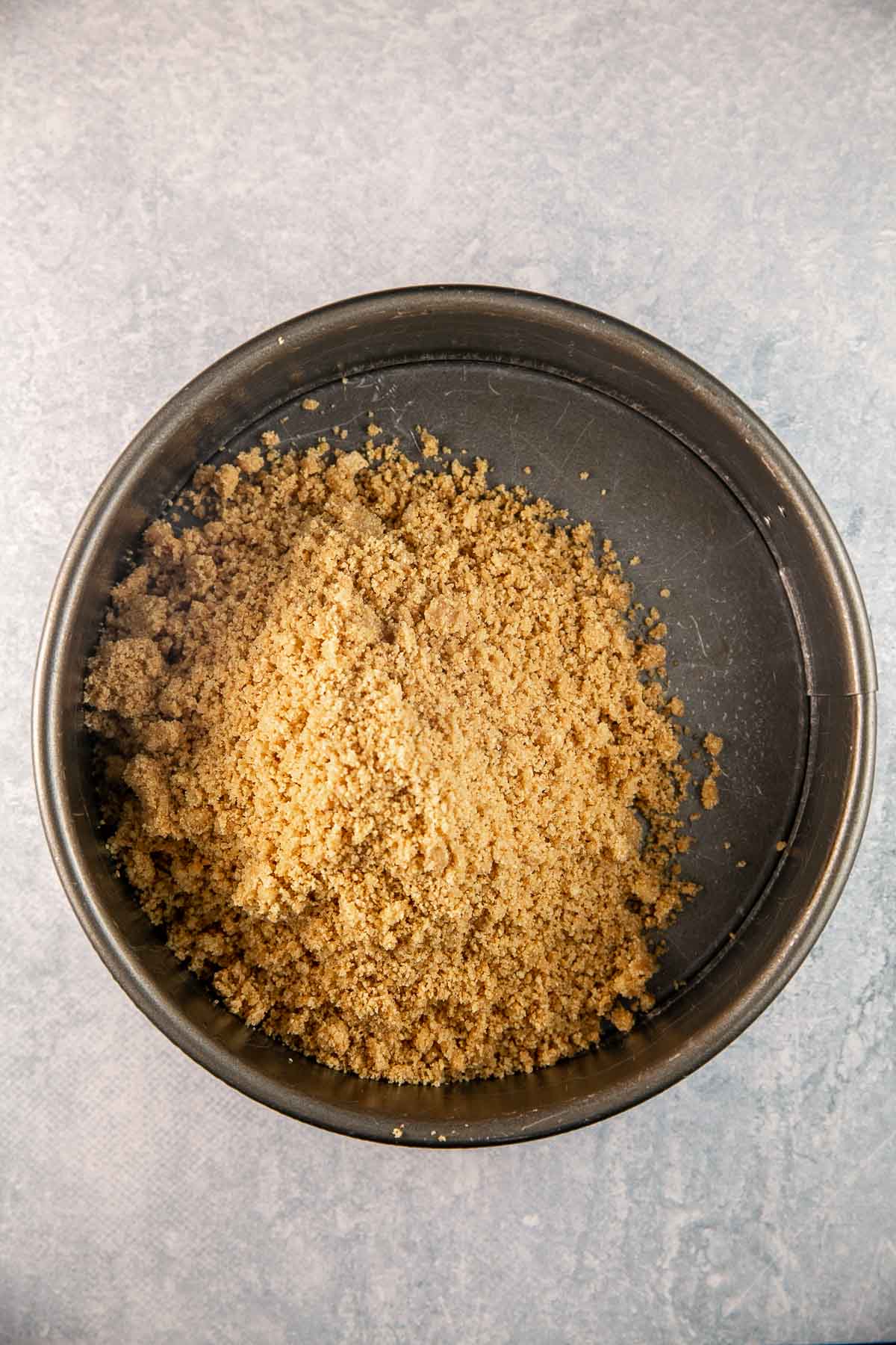 graham cracker crumbs in a springform pan