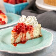 cheesecake with strawberry sauce and whipped cream