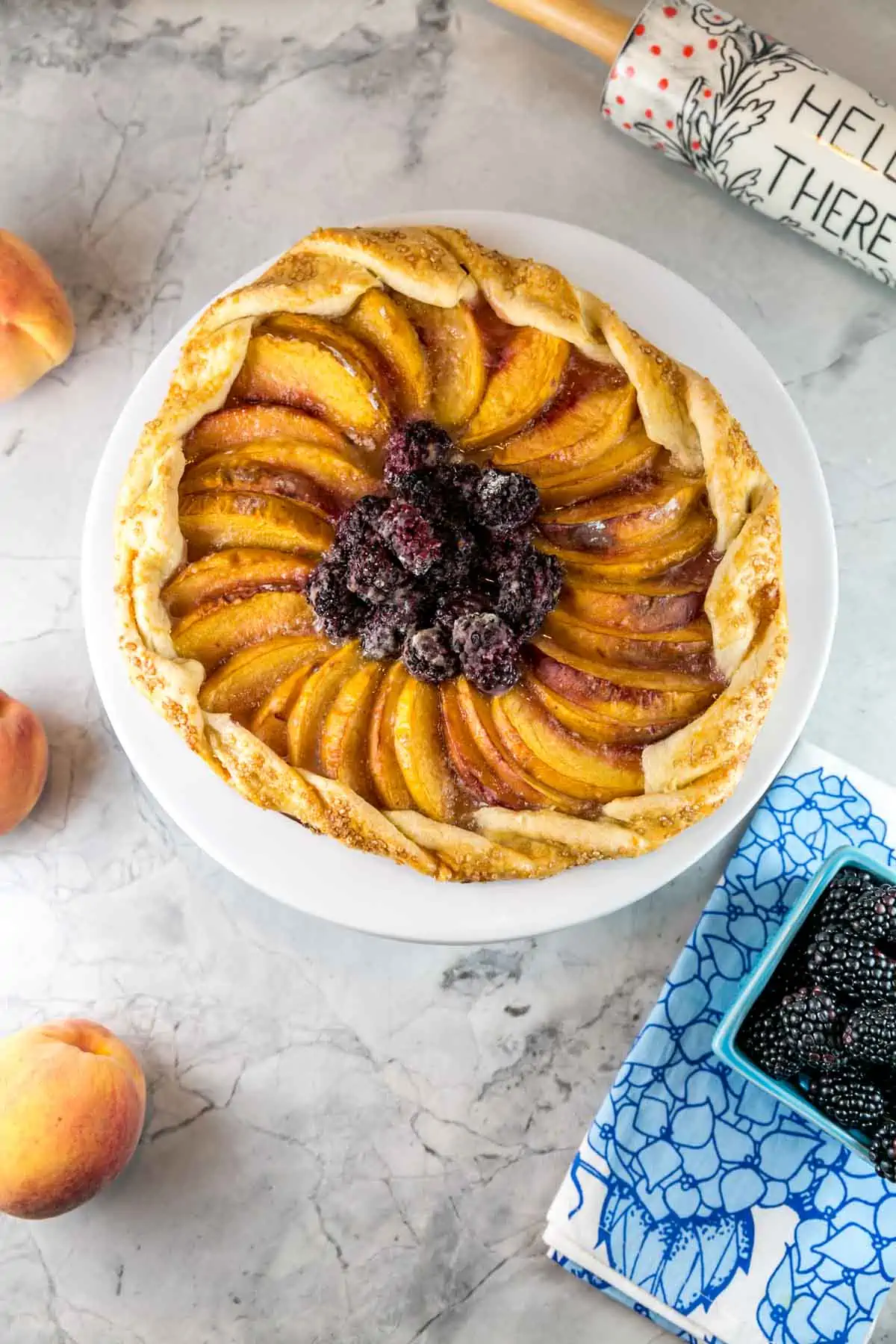 galette filled with blackberries and peaches on a dessert plate