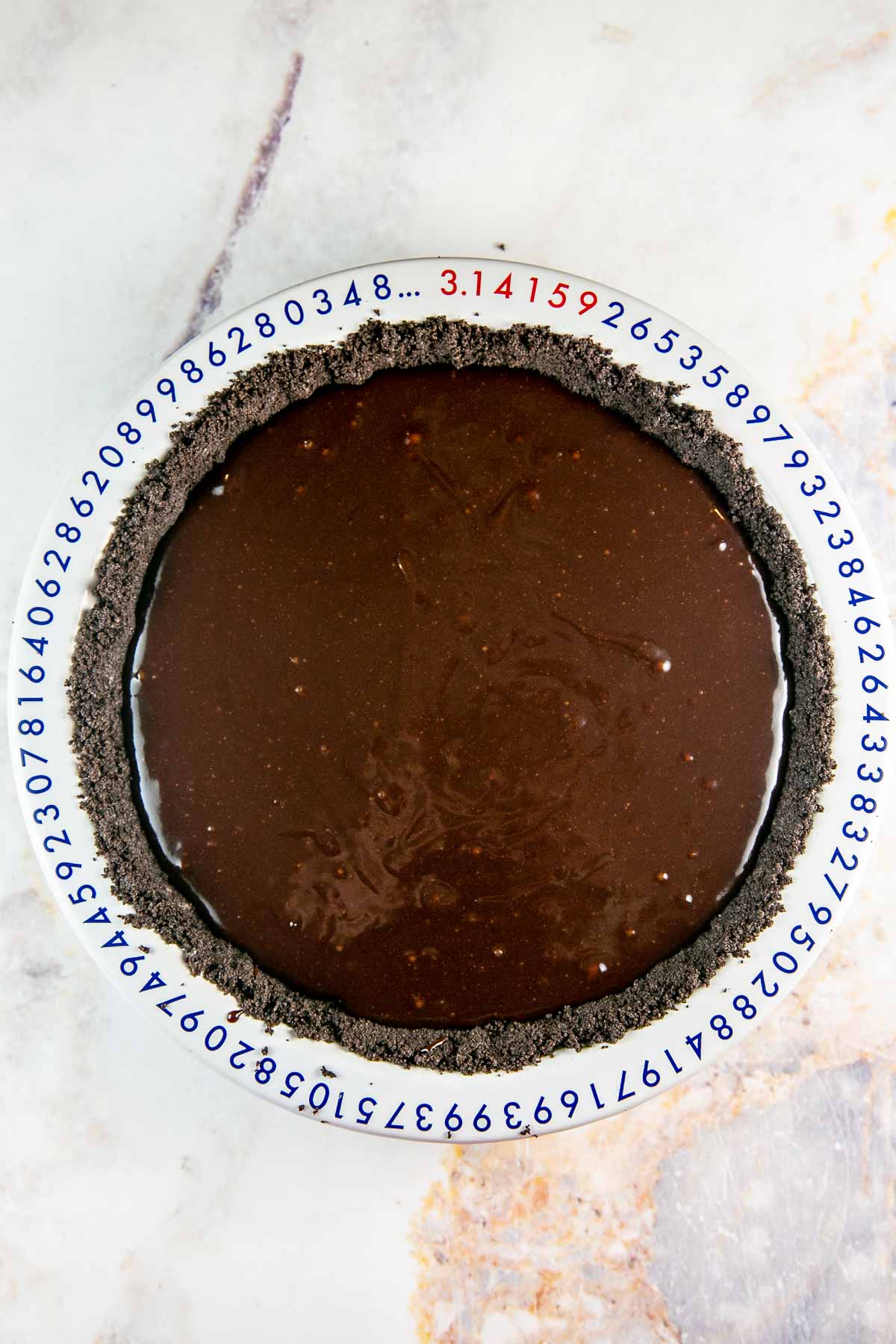 unbaked brownie batter in an oreo crust