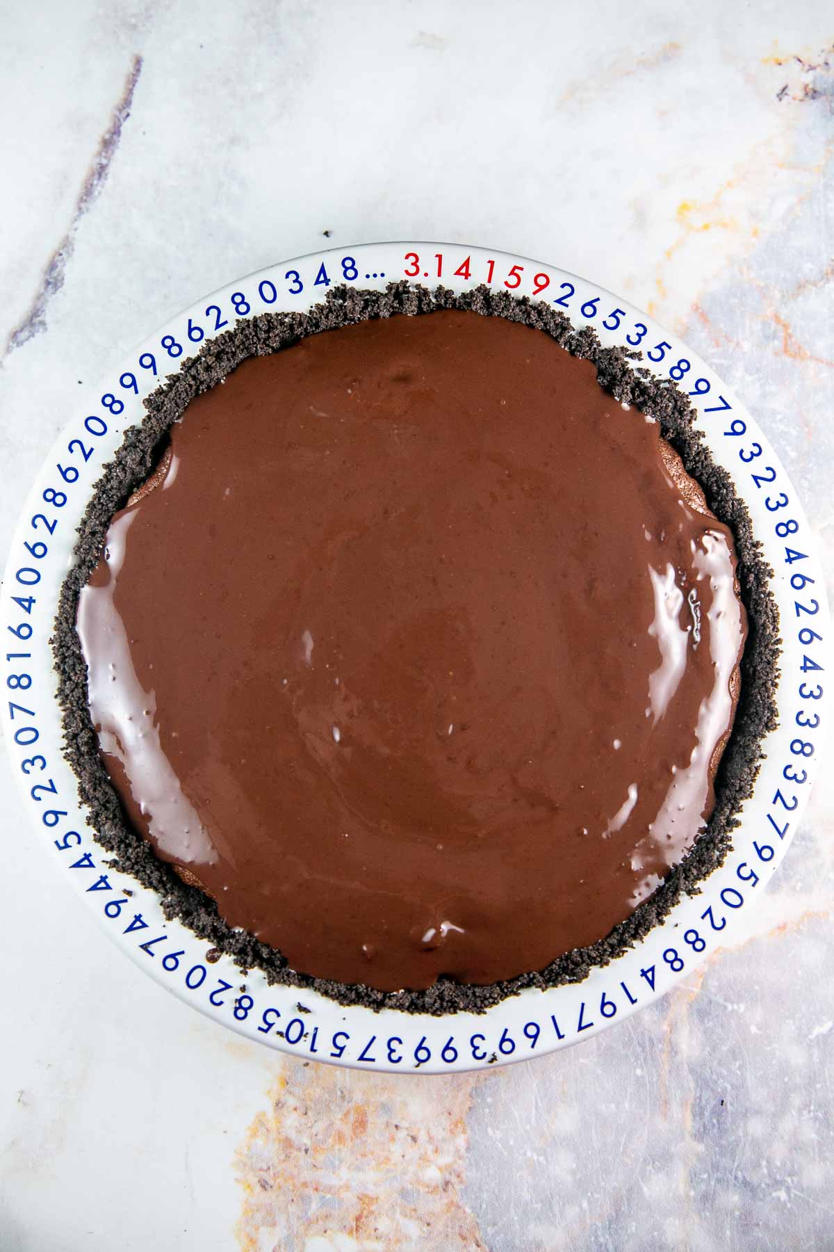 shiny soft ganache covering a brownie pie