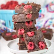 stack of raspberry brownies on a plate