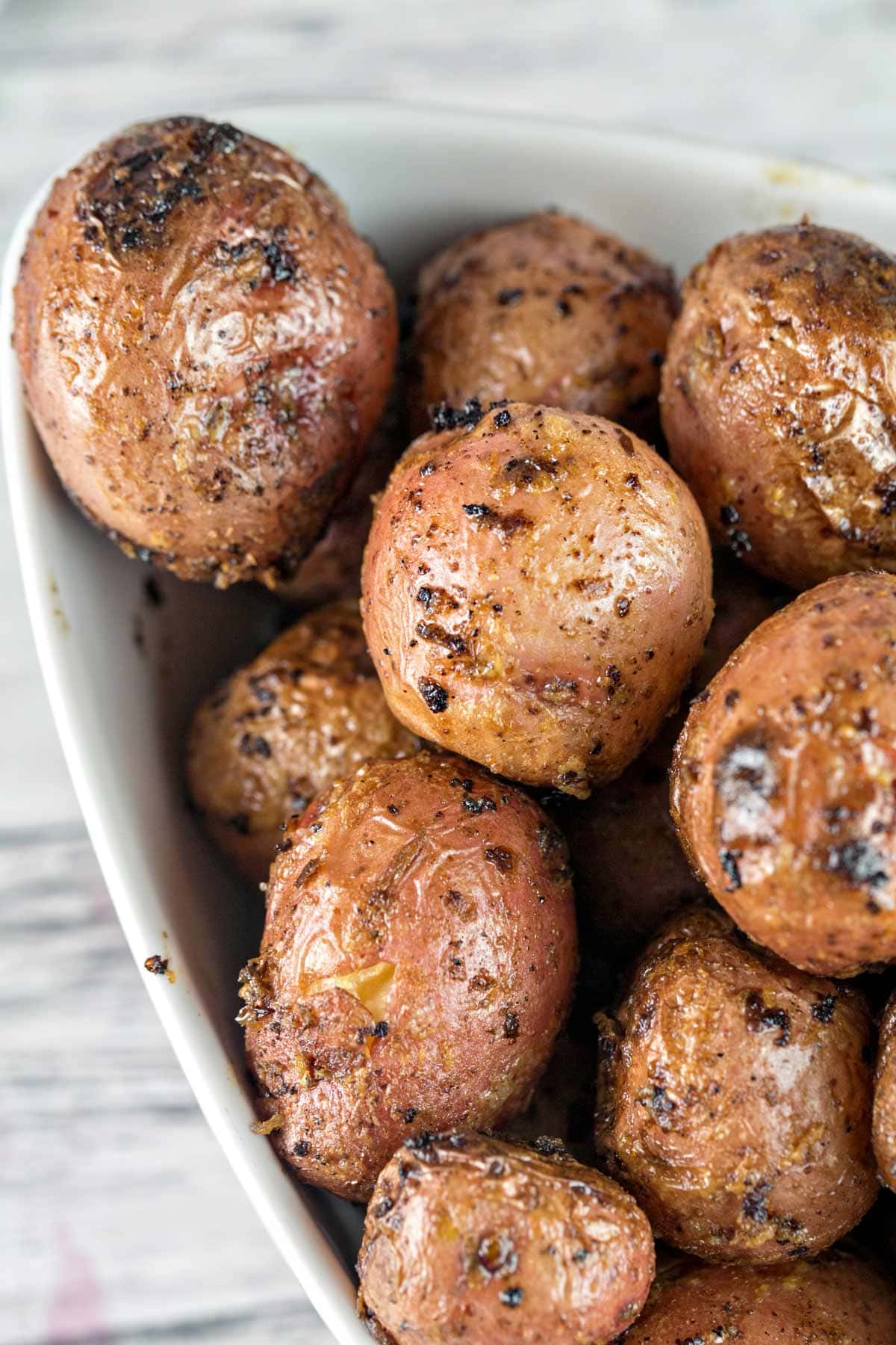 pile of grilled baby potatoes with slightly charred skins