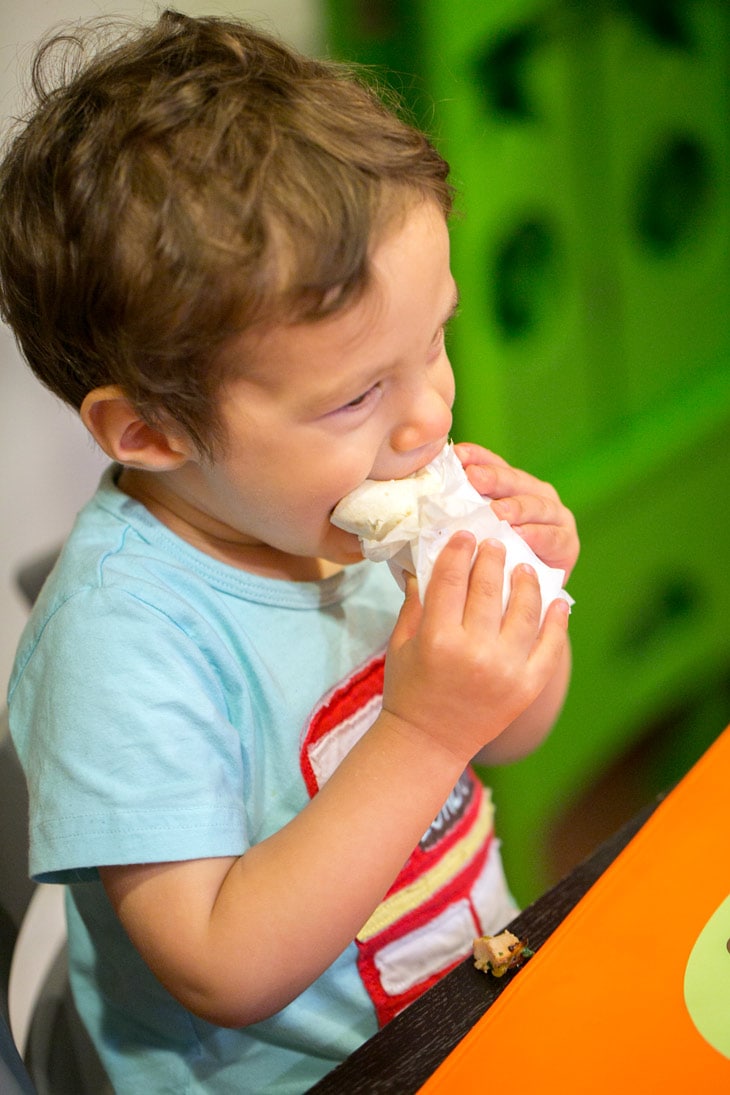 toddler eating a pork tenderloin wrap