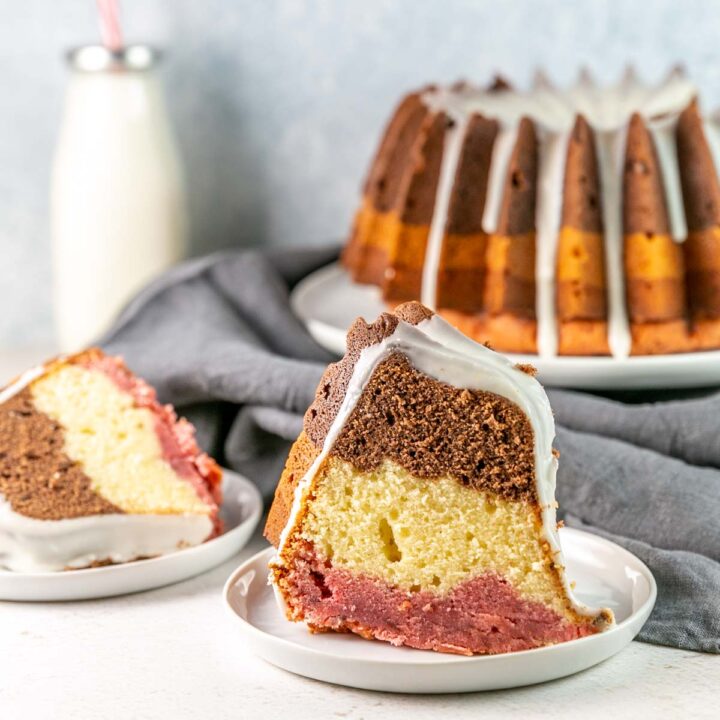 two slices of neopolitan bundt cake with vanilla glaze
