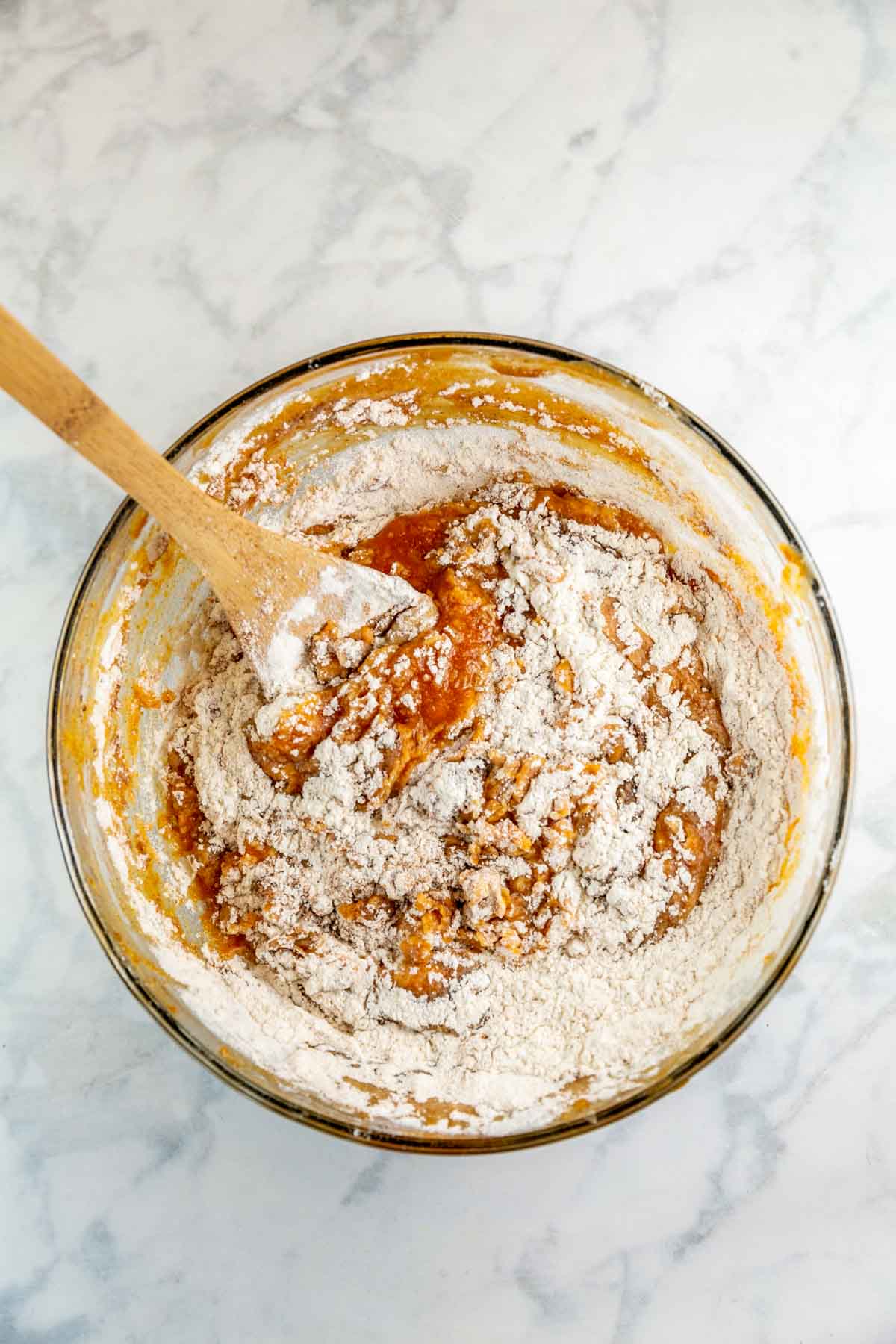 glass mixing bowl filled with ingredients.