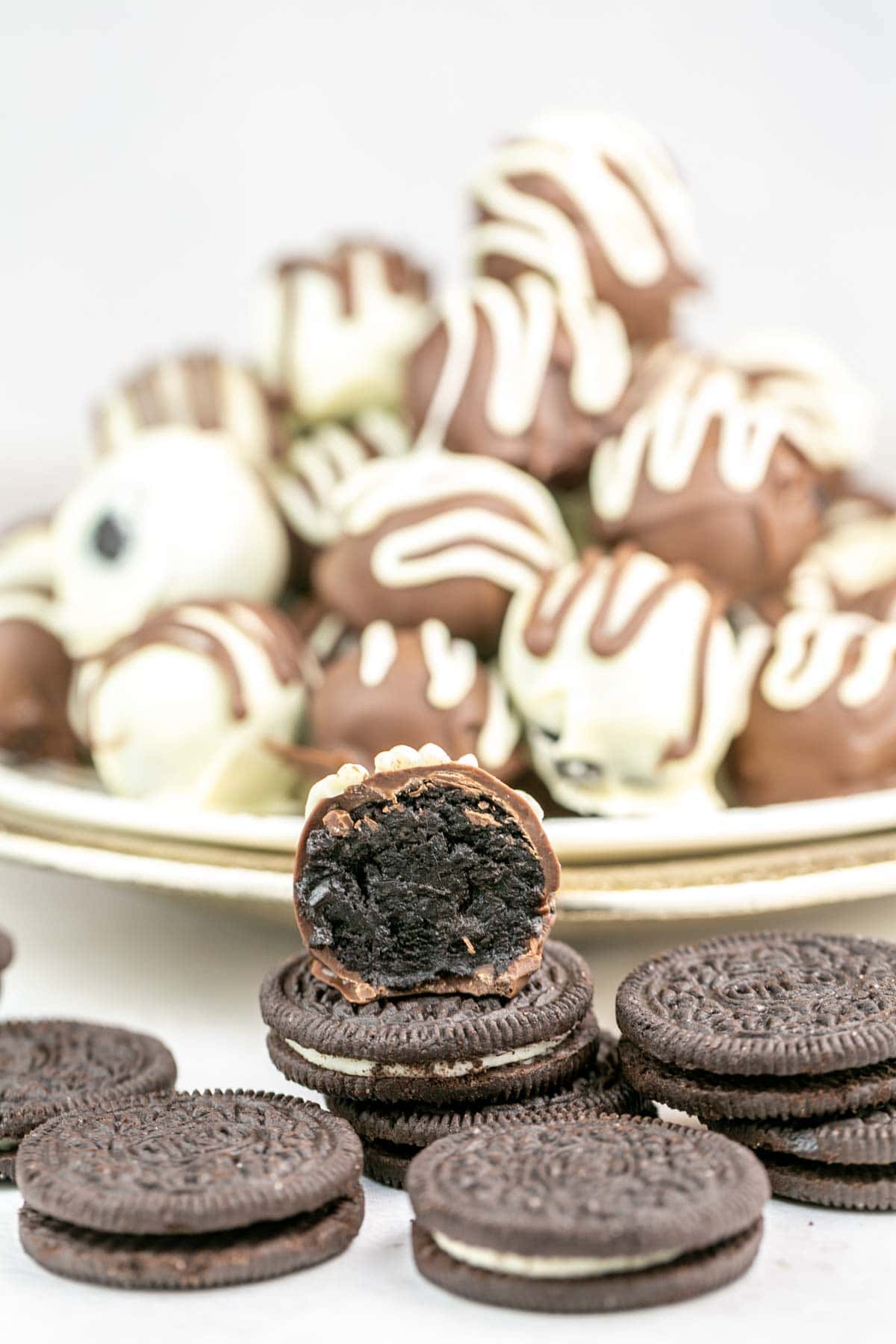 oreo truffle bit in half showing the creamy oreo center