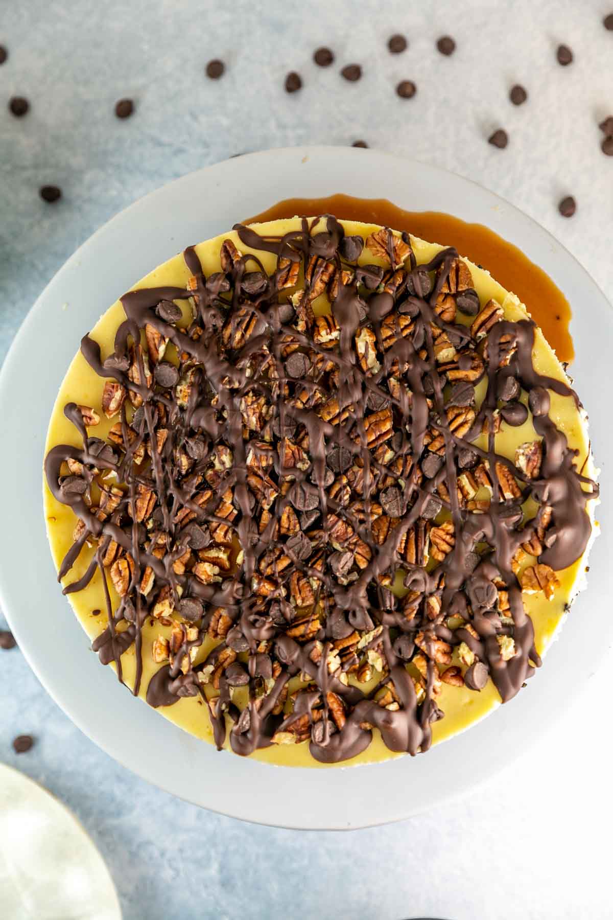 Birds eye view of whole cheesecake on a cake stand.