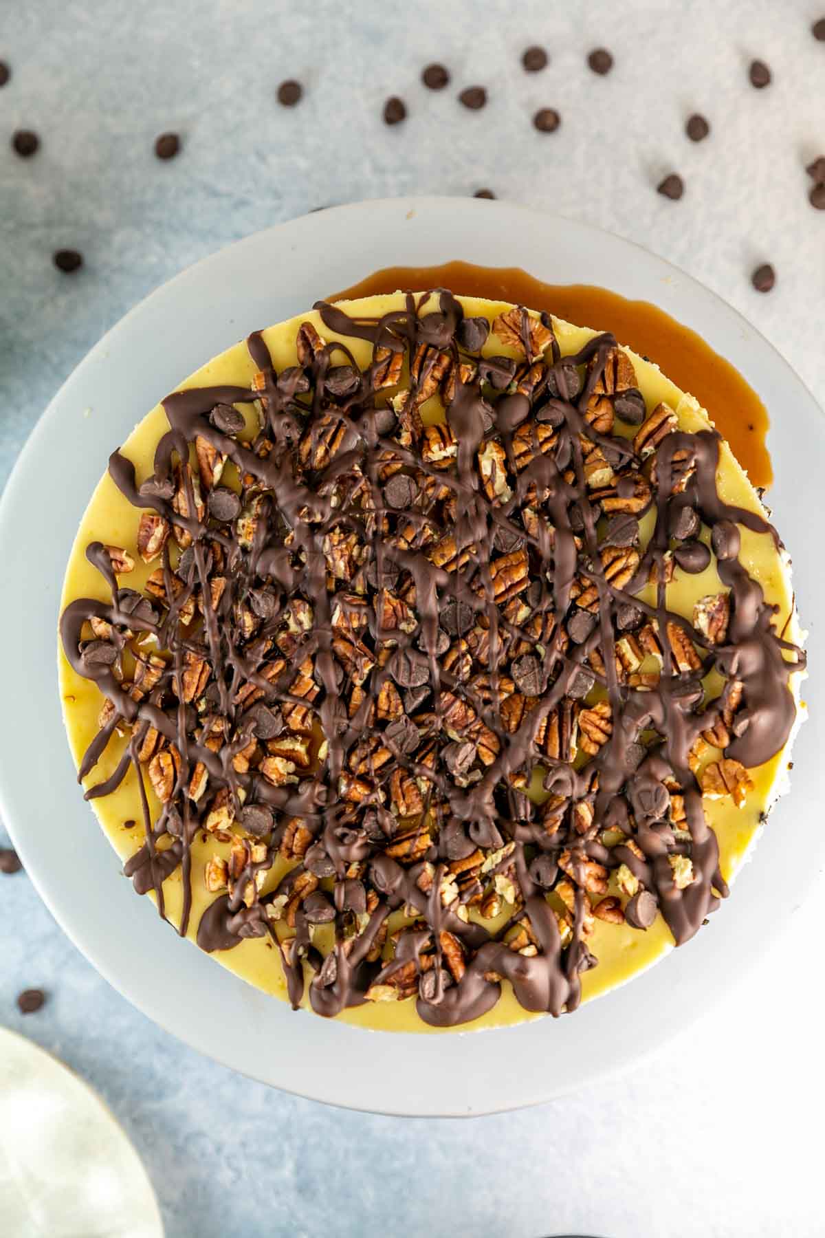 Birds eye view of whole cheesecake on a cake stand. 