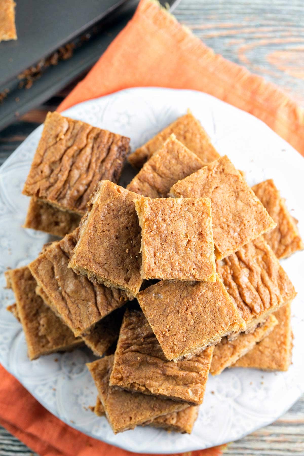 square blondies on a white textured dessert plate