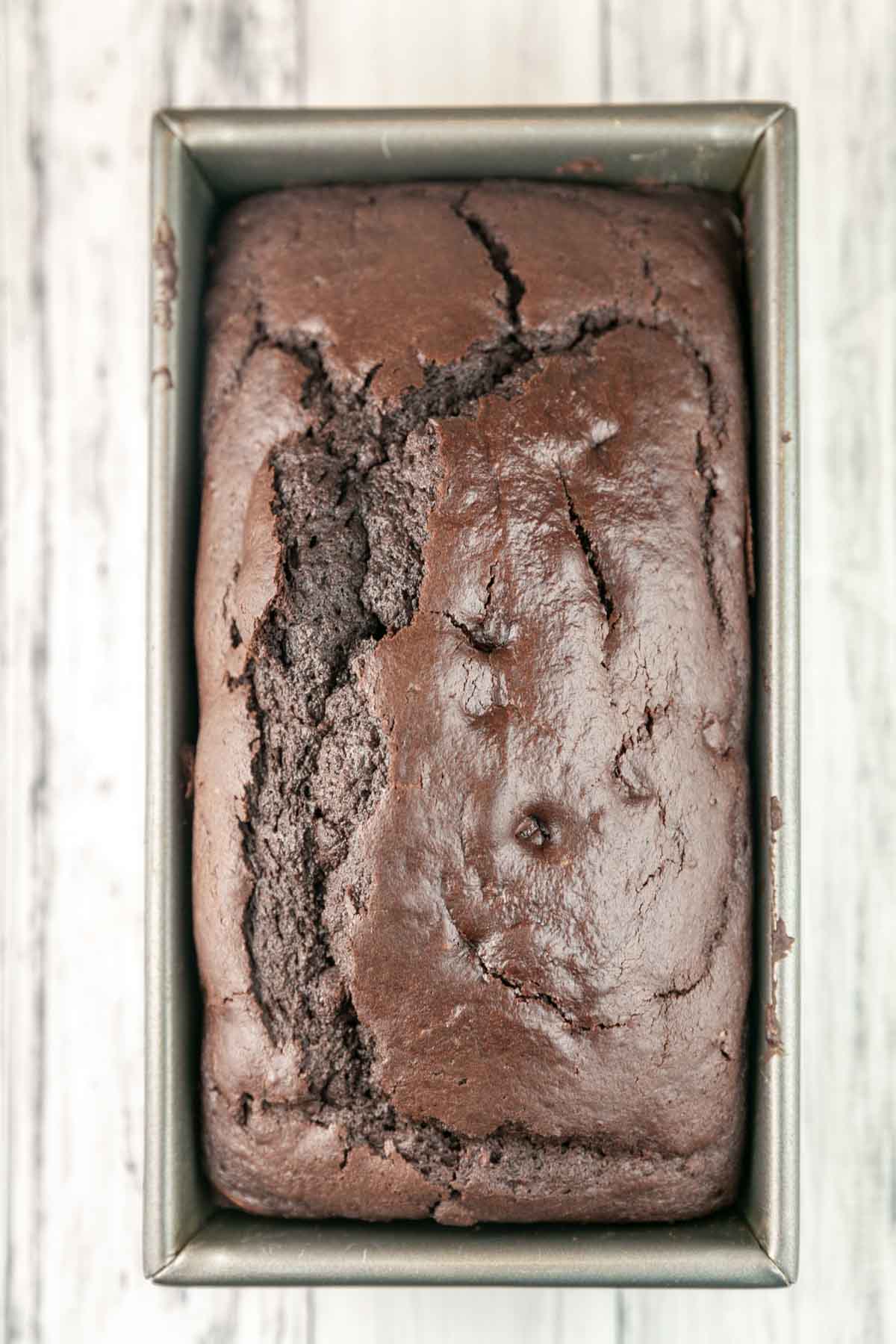 overhead view of chocolate bread still in a loaf pan