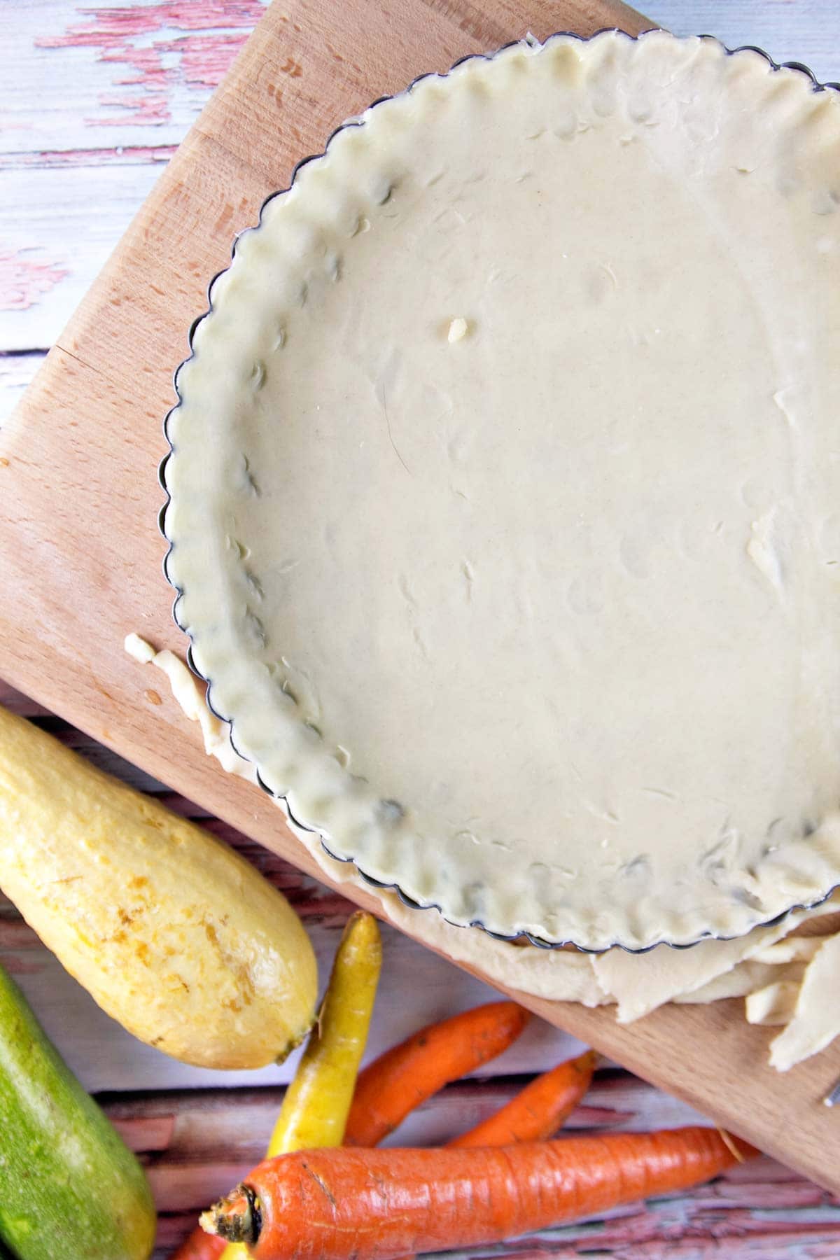 pie crust in a tart pan before baking