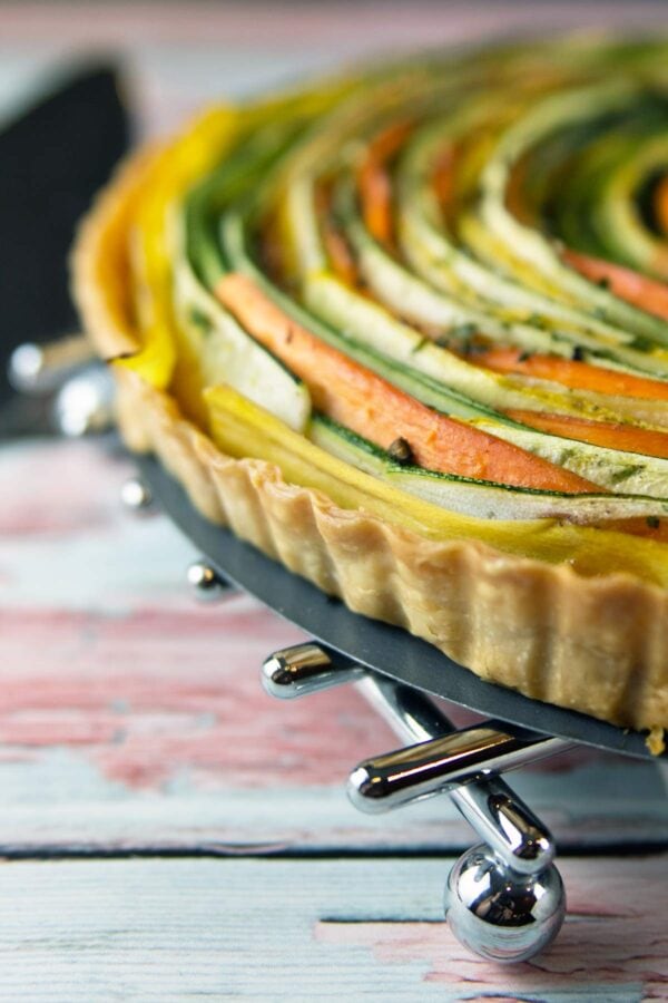 close up view of spiraled vegetables in a tart