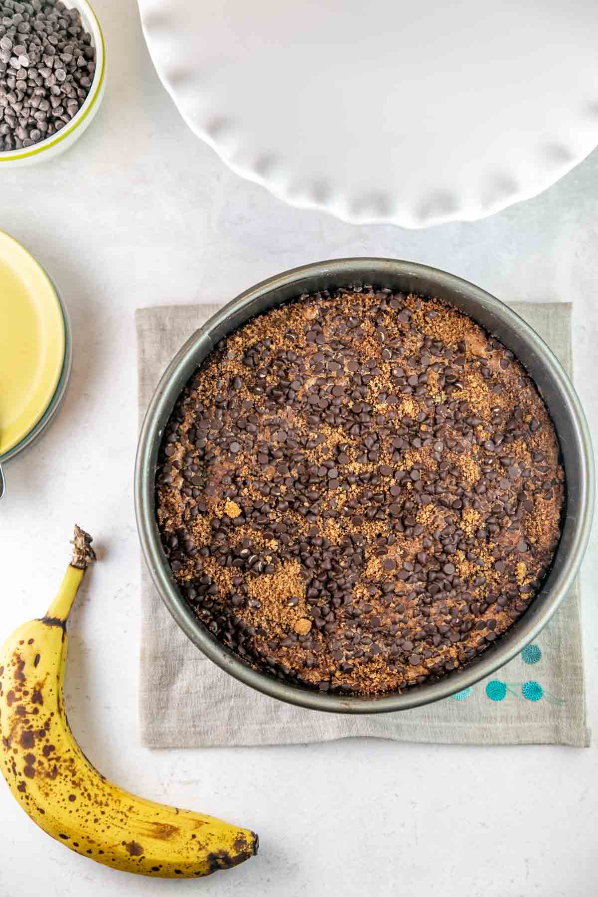 banana coffee cake with chocolate chip streusel in a springform pan