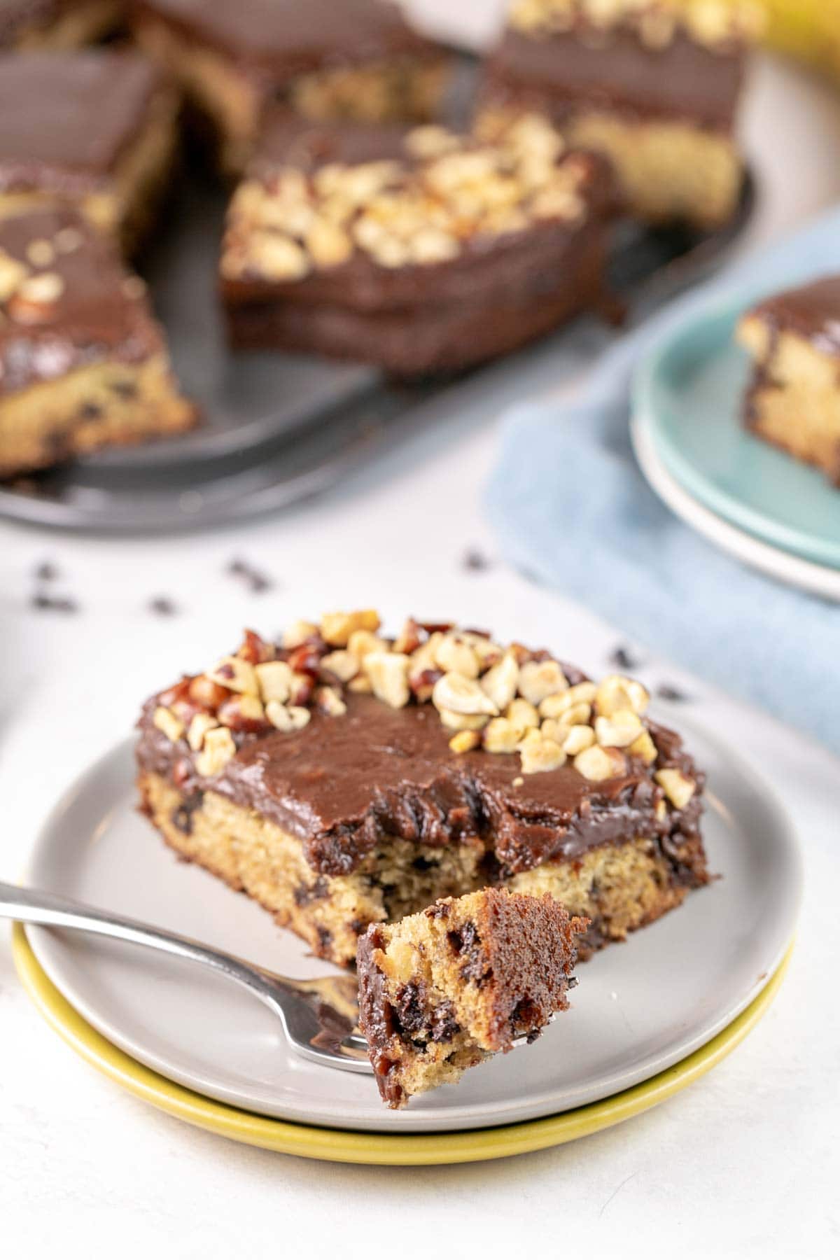 slice of cake with a fork removing one bite size piece