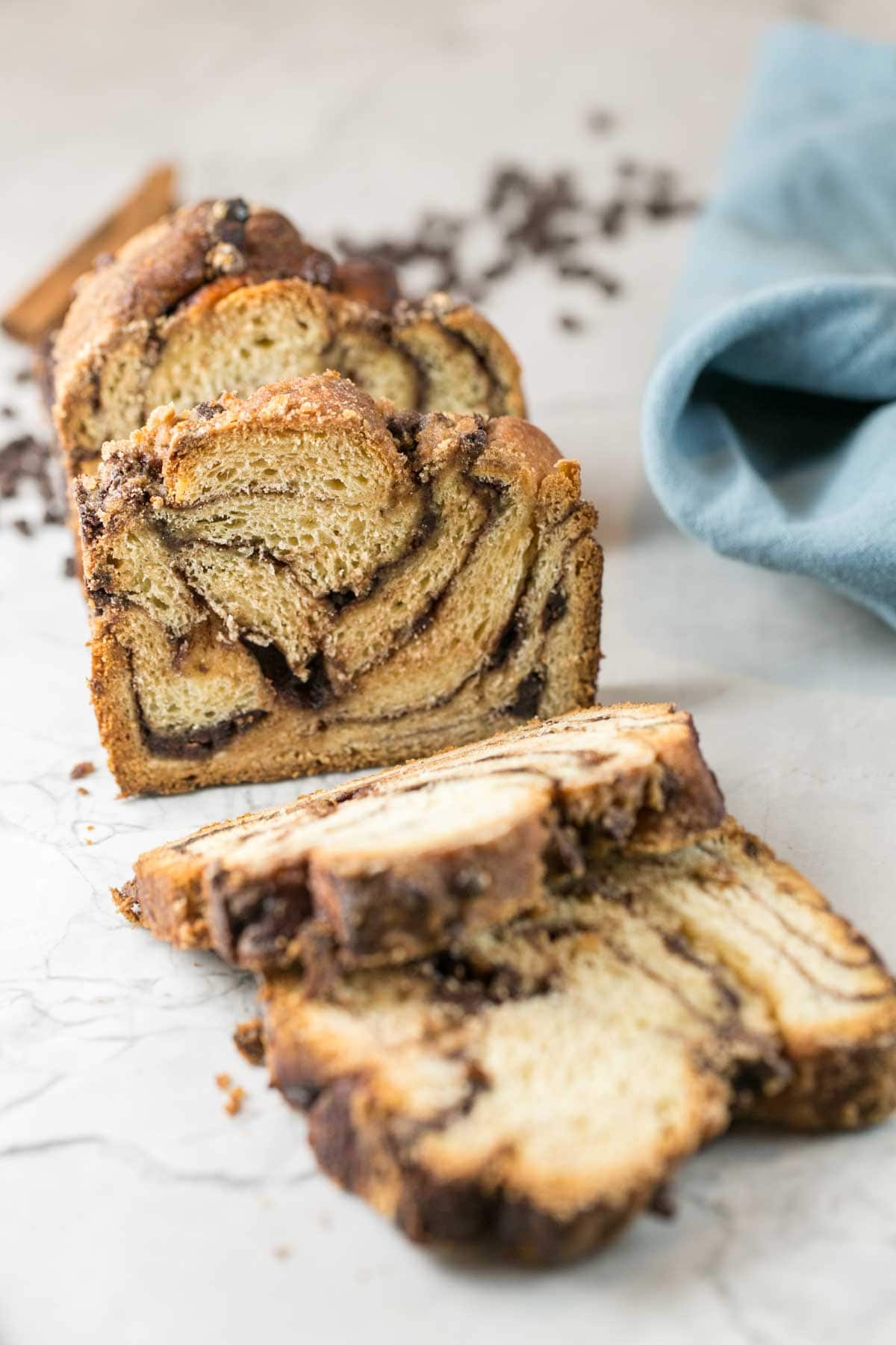 loaf of babka sliced open to show the swirls of chocolate inside