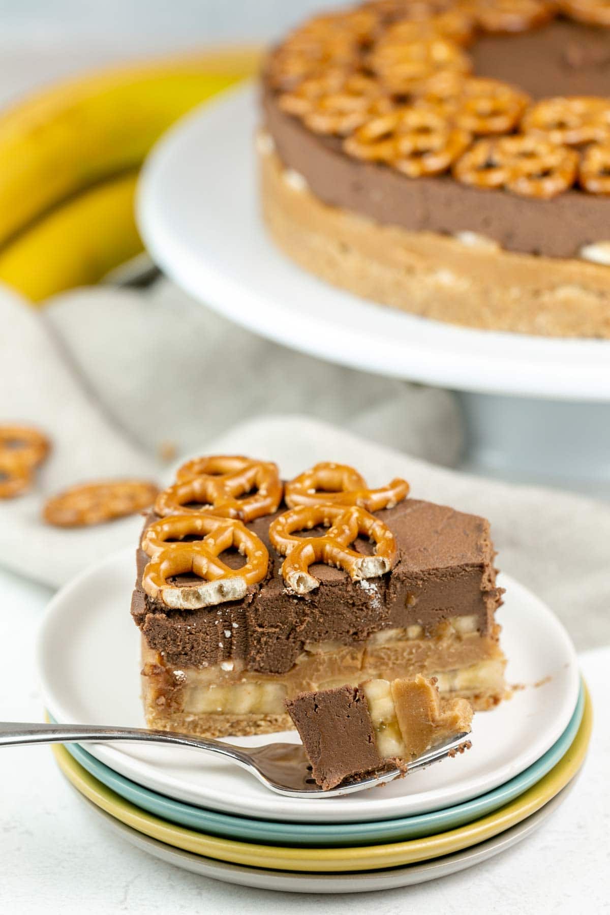 slice of peanut butter pretzel pie pie on a plate with a fork 
