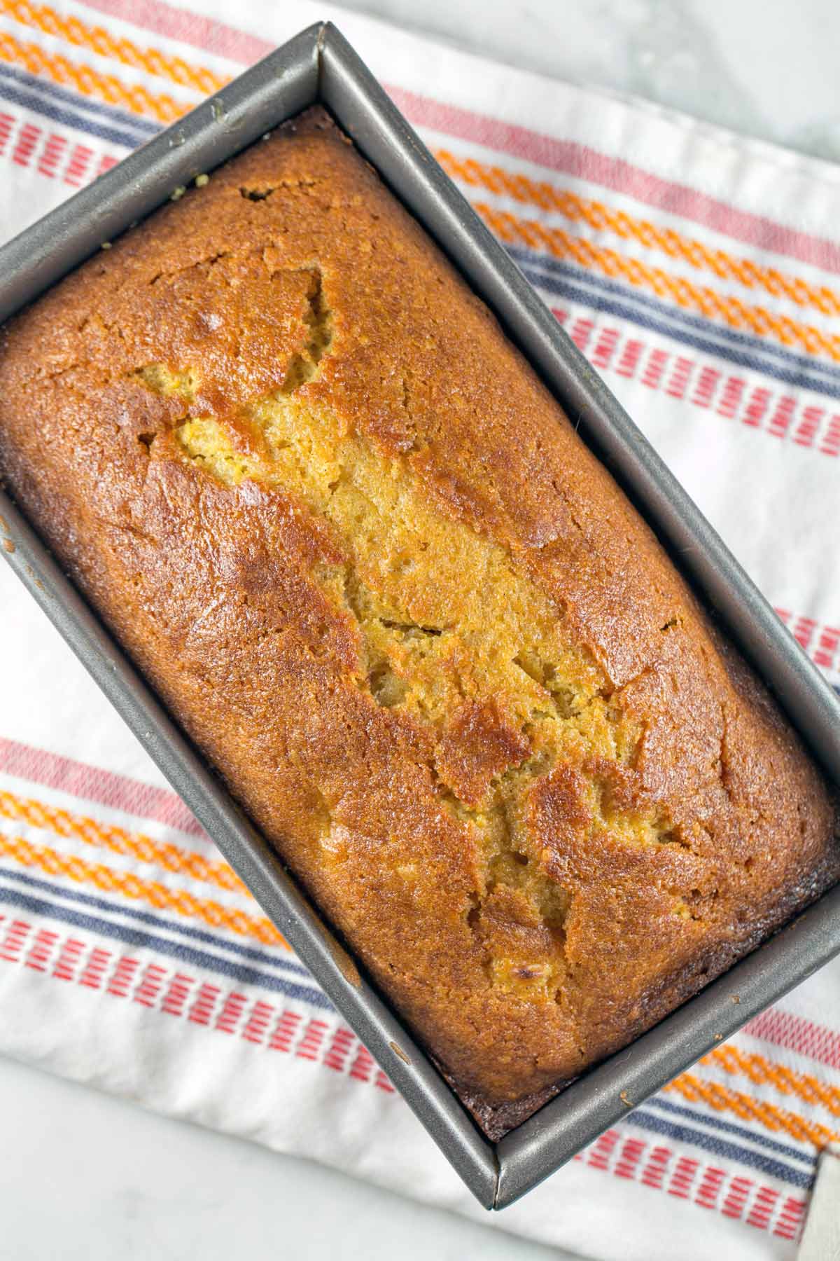 freshly baked clementine quick bread still in the loaf pan