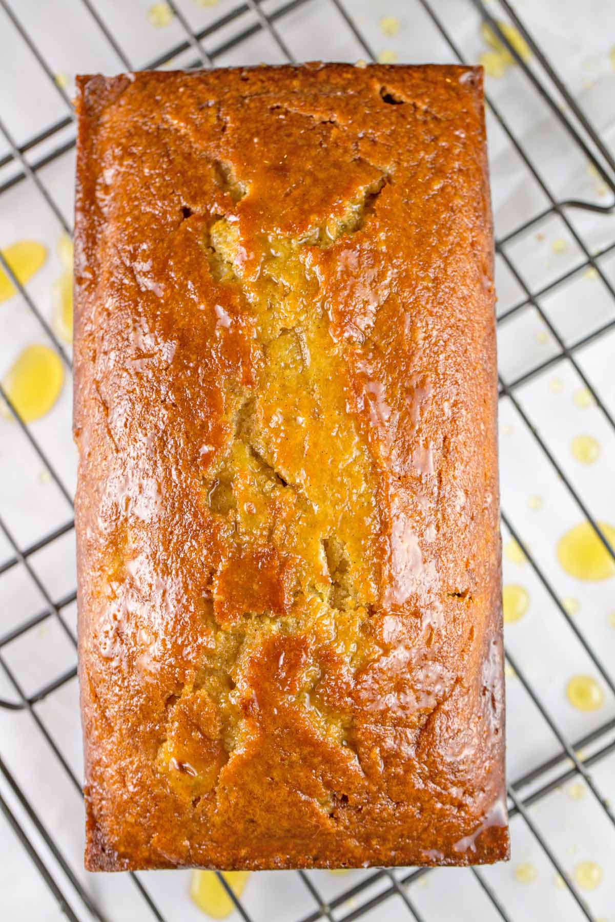 loaf of clementine bread with a clementine simple syrup poured across the top