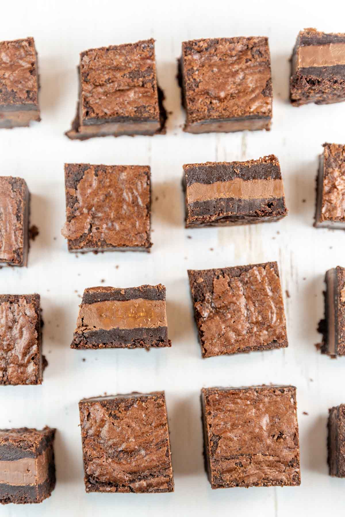 squares of nutella brownies arranged with some brownies flipped on their sides