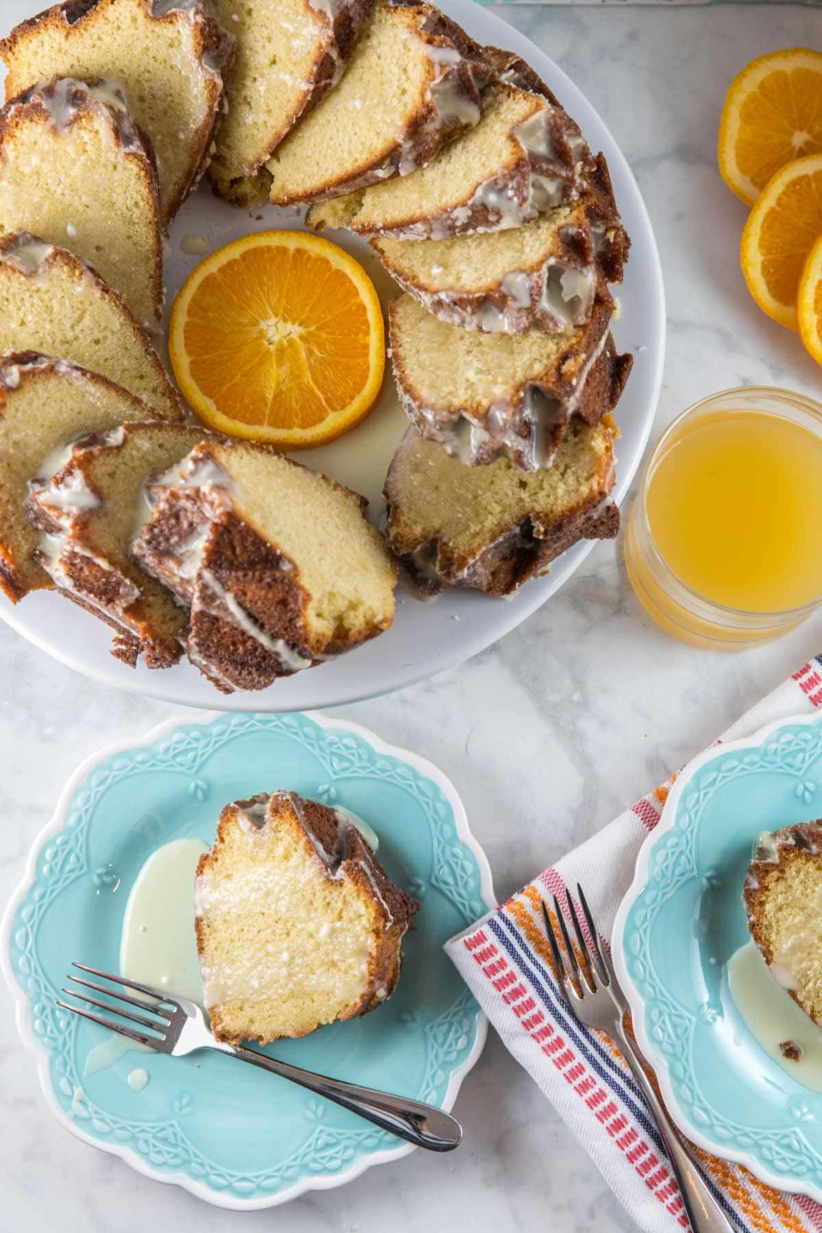 bundt cake cut into thick slices and covered with an orange glaze