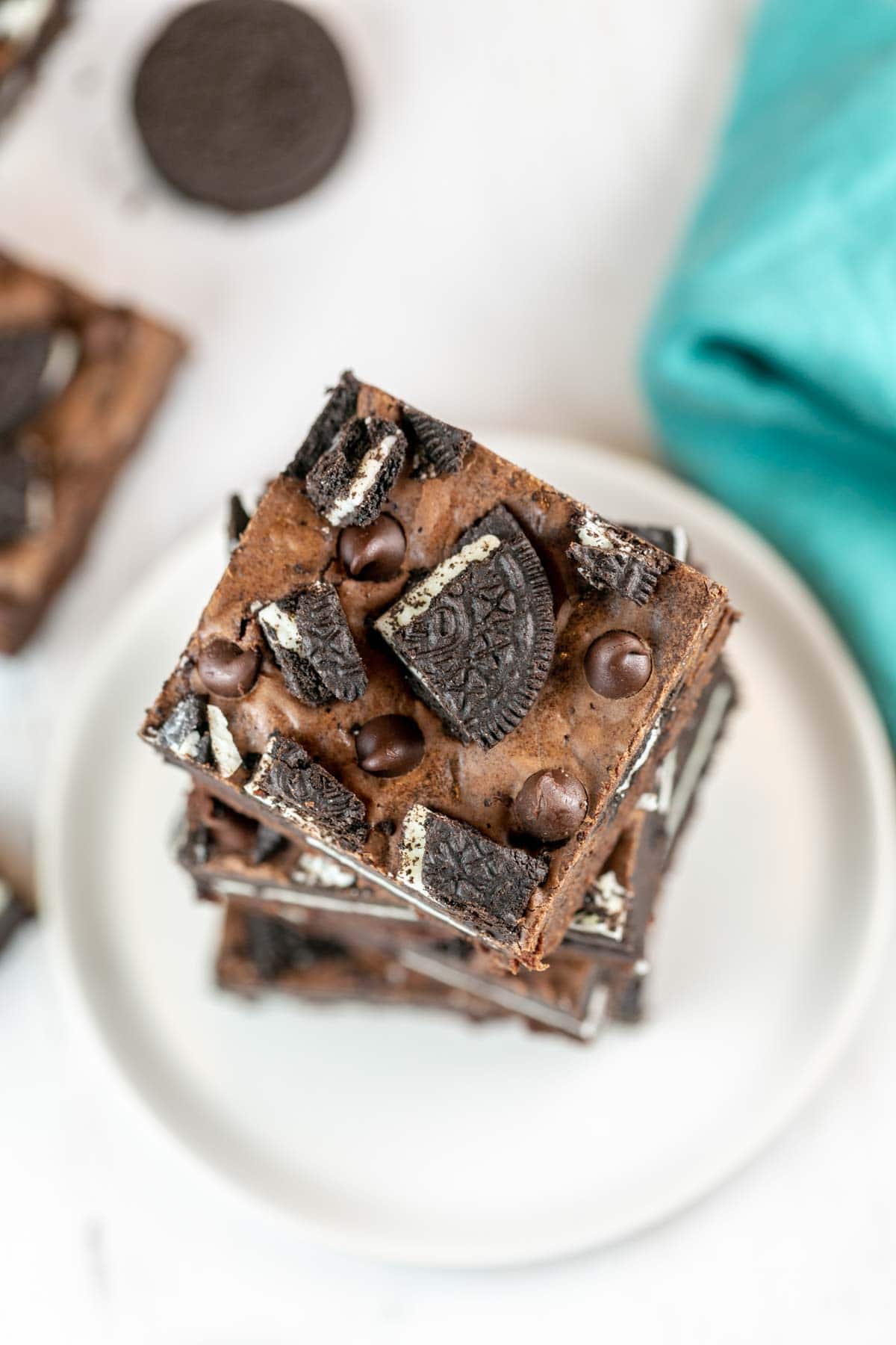 fudgy brownies covered with chopped oreos and chocolate chips