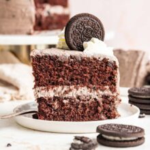 slice of two layer oreo cake with oreo frosting