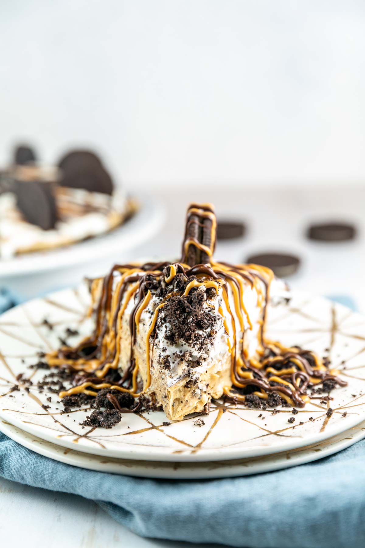 slice of peanut butter pie pie on stacked dessert plates