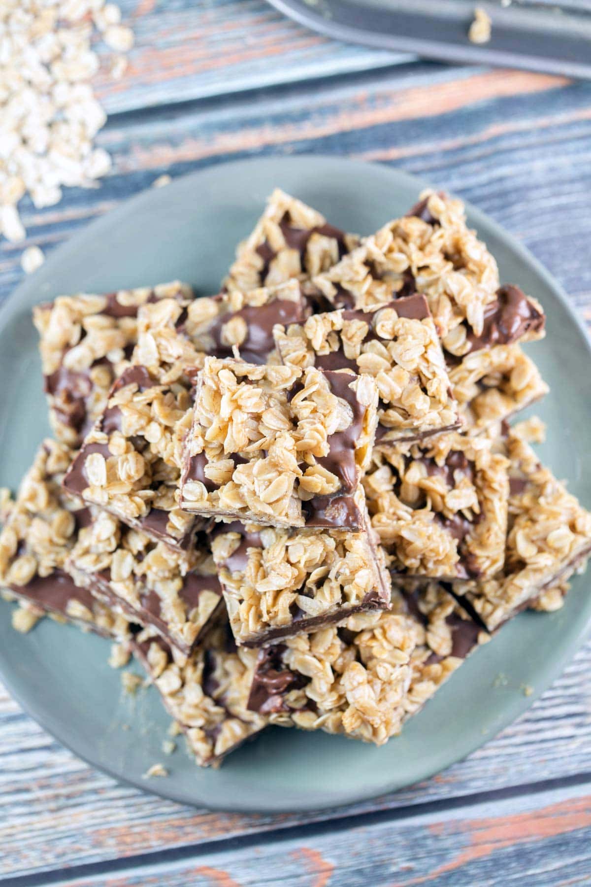 stack of chocolate and peanut butter oatmeal bars on a round plate