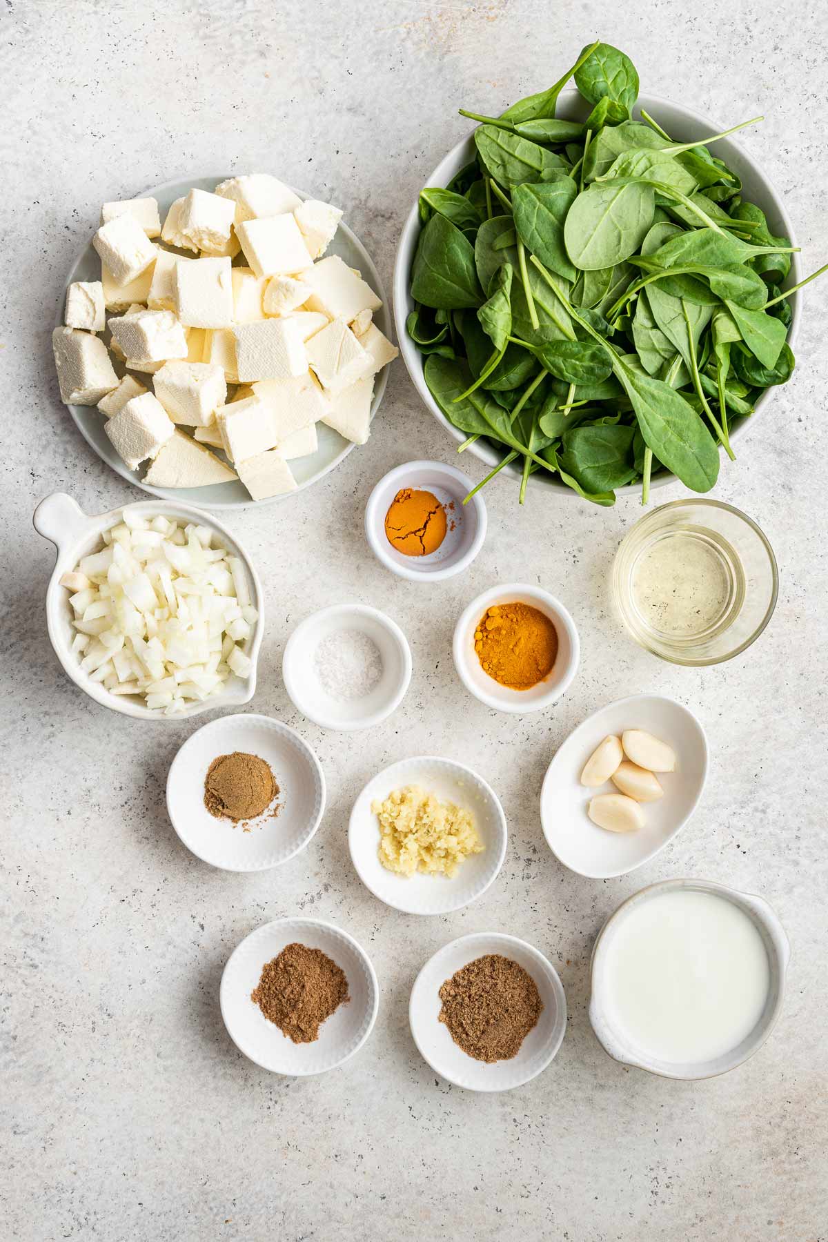 overhead view of the ingredients used to make saag paneer