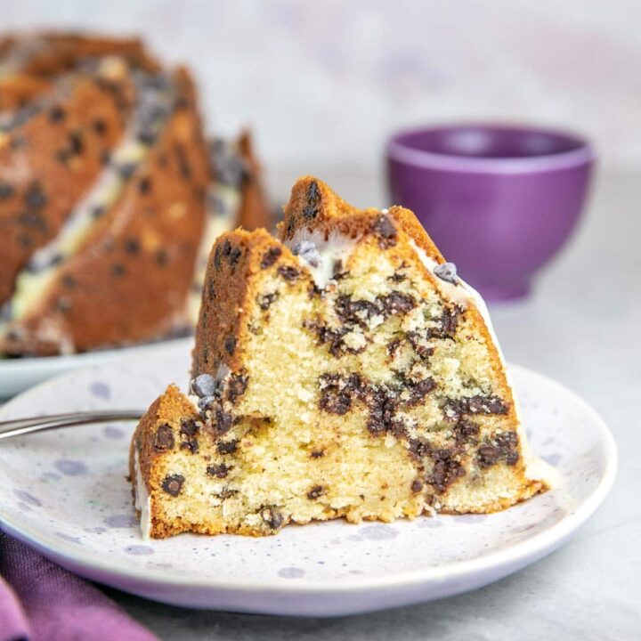 slice of bundt cake filled with chocolate chips on a dessert plate