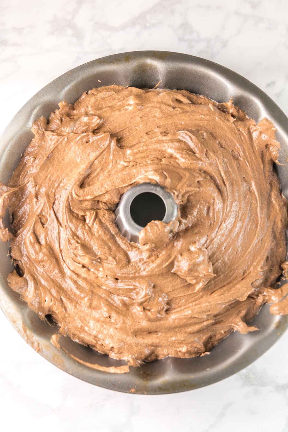chocolate pound cake batter in a bundt pan