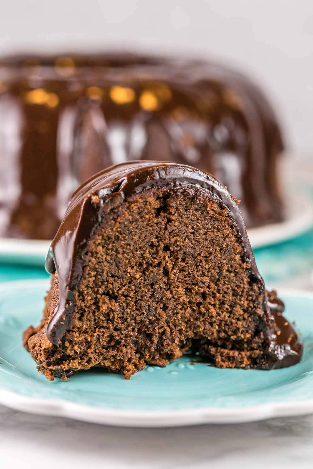 a slice of chocolate pound cake covered with chocolate ganache