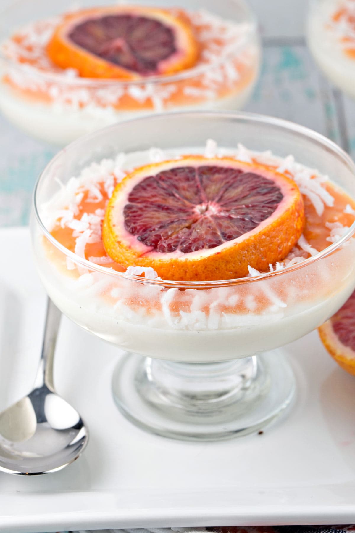 Two glass desert bowls full of coconut panna cotta