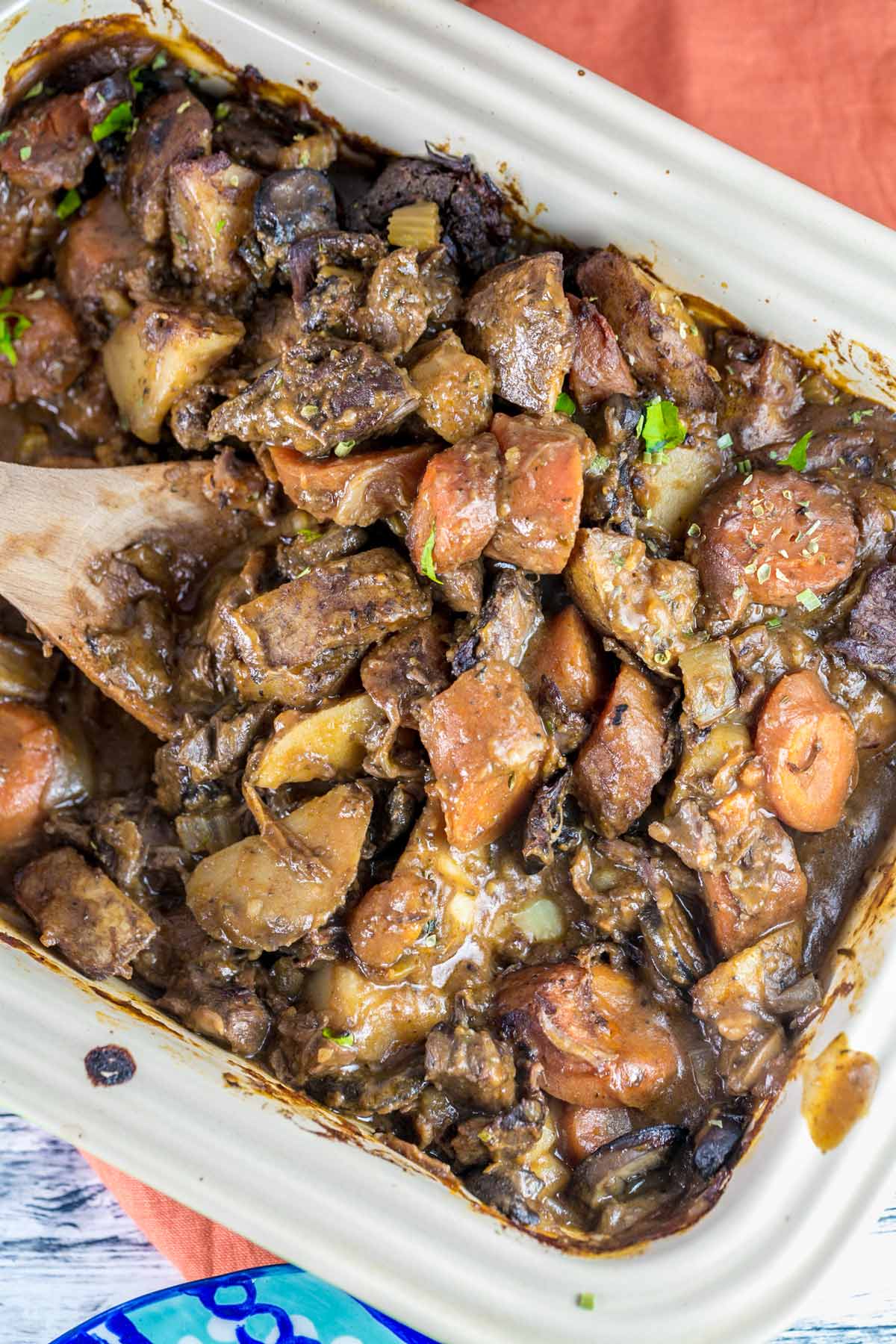 overhead view of instant pot beef stew poured into a large casserole dish