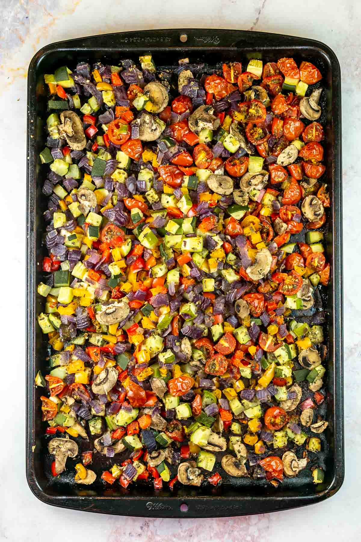 Top view of baking sheet with roasted veggies. 