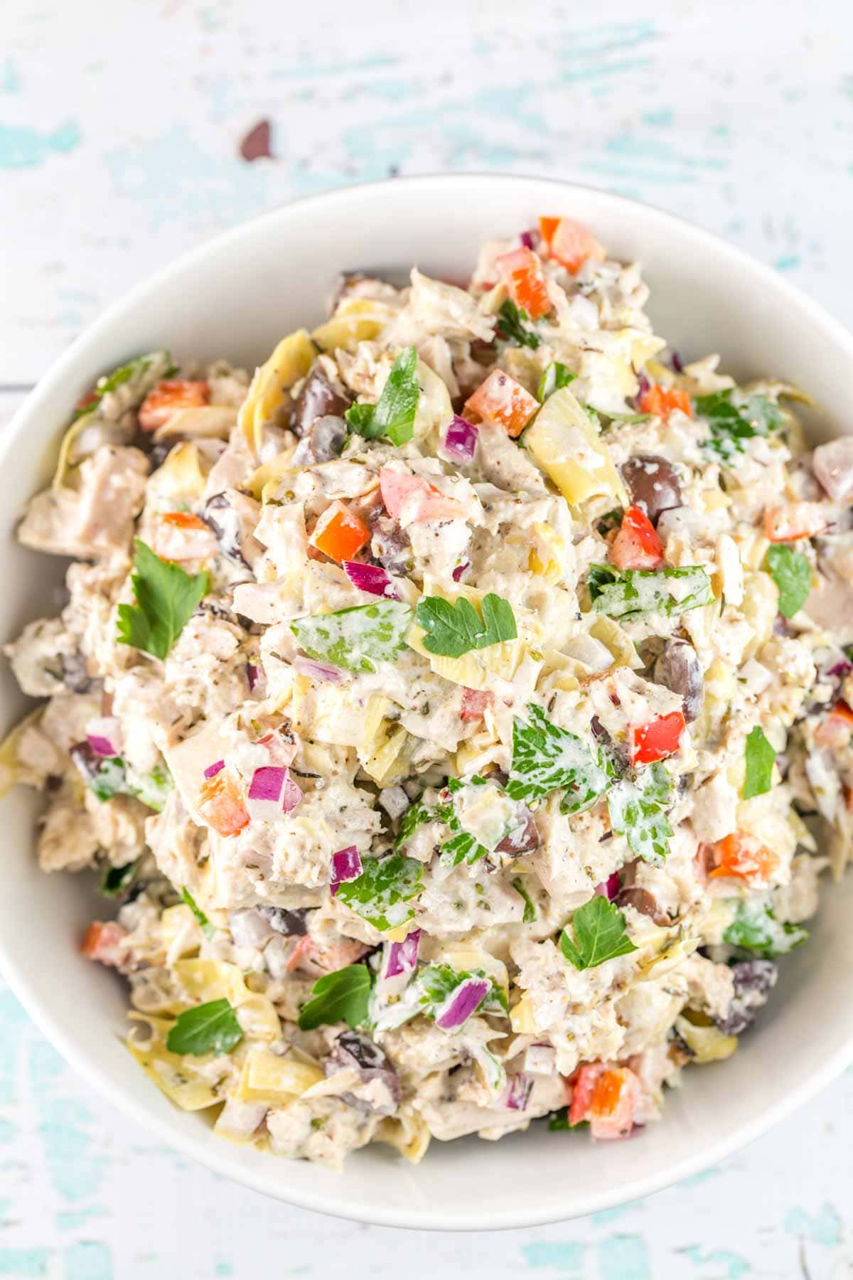 a large white serving bowl filled with mediterranean tuna salad