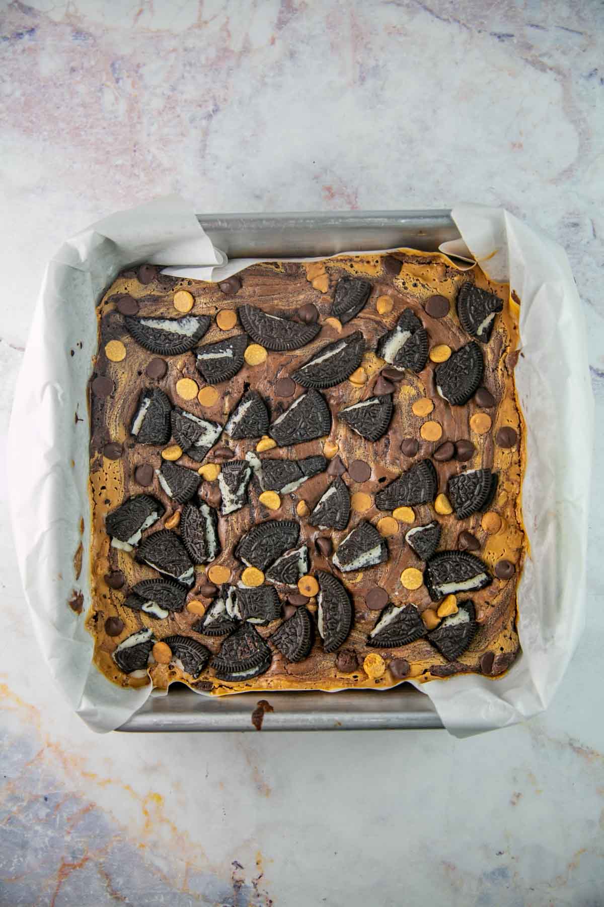 Top view of Oreo brownies in the brownie pan before being cut.