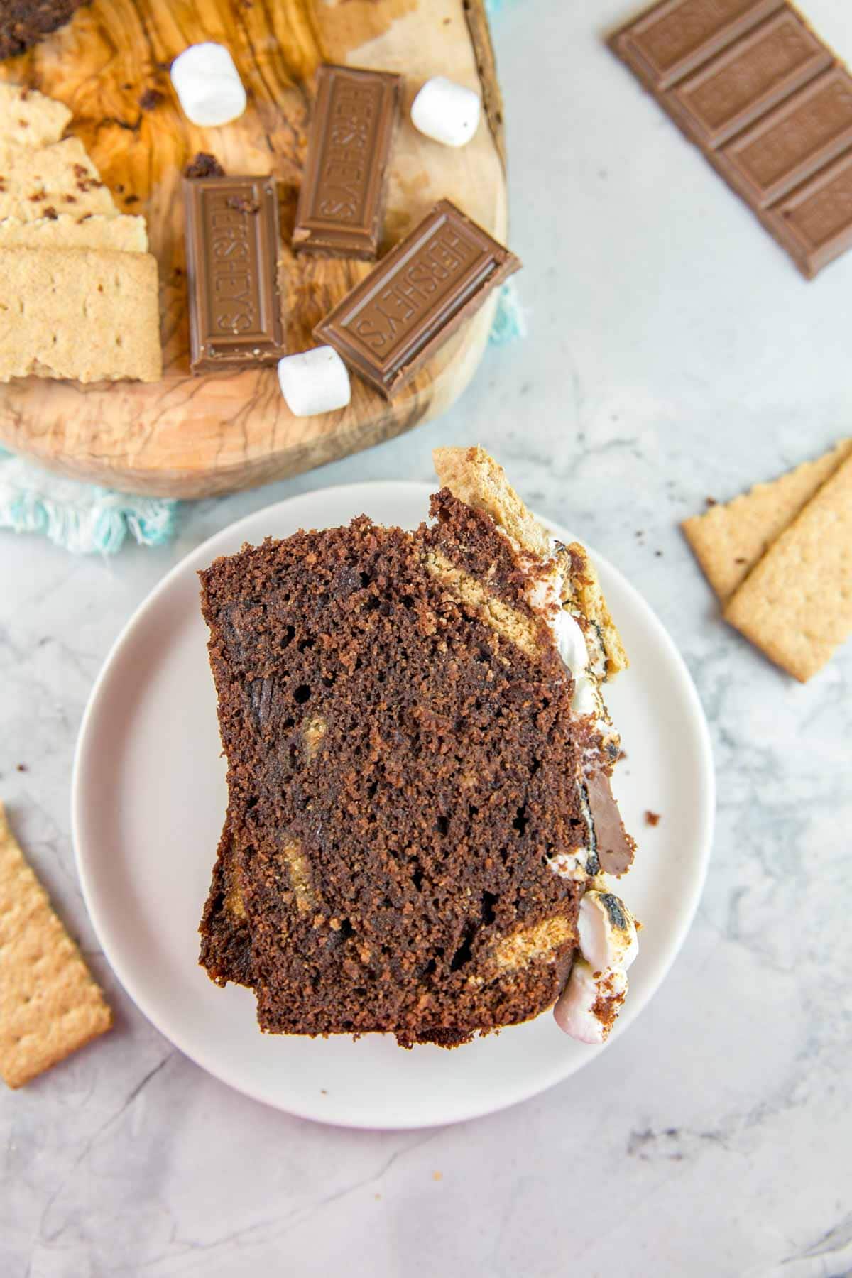 slice of chocolate quick bread with visible pieces of graham crackers in the bread