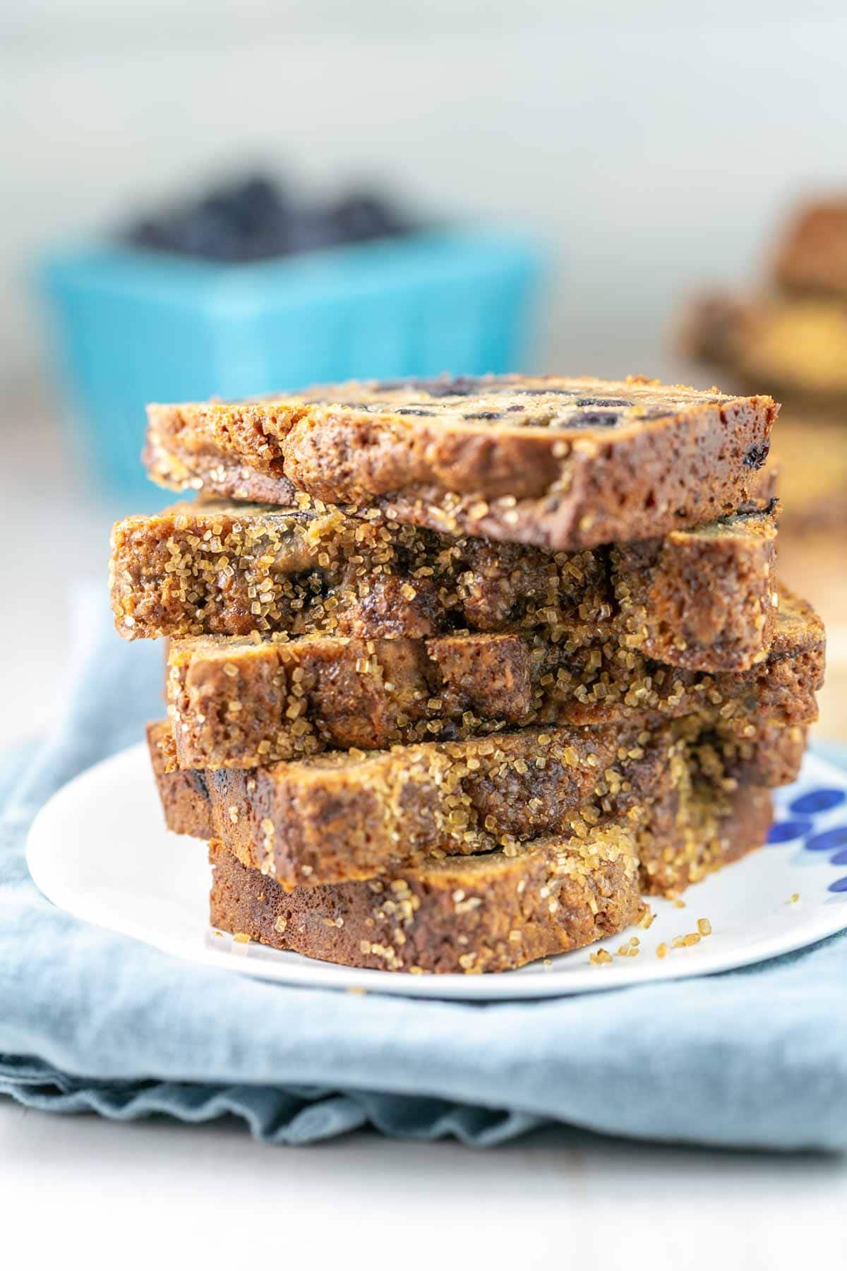 side view of a stack of 5 pieces of blueberry honey quick bread