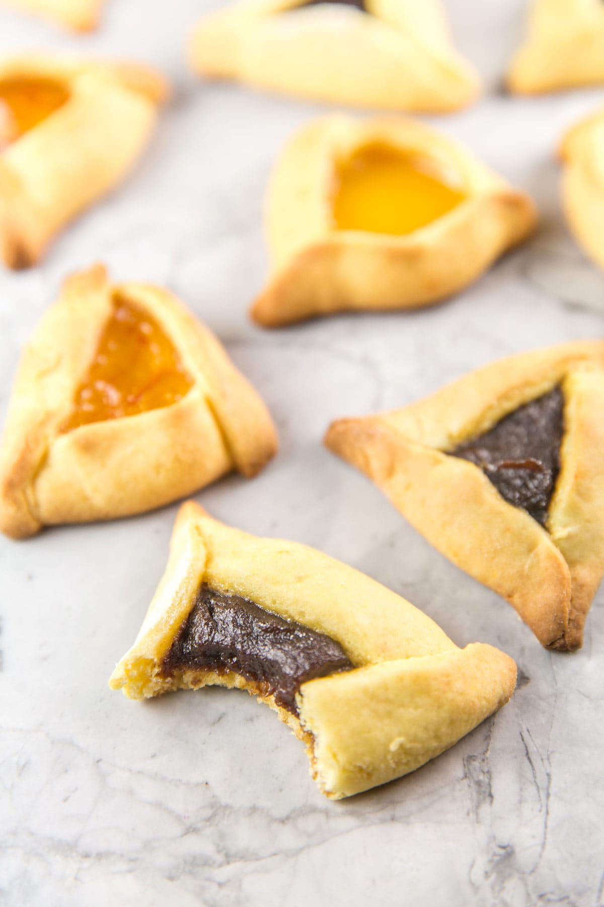 apple butter hamantaschen with a bite taken out of the side