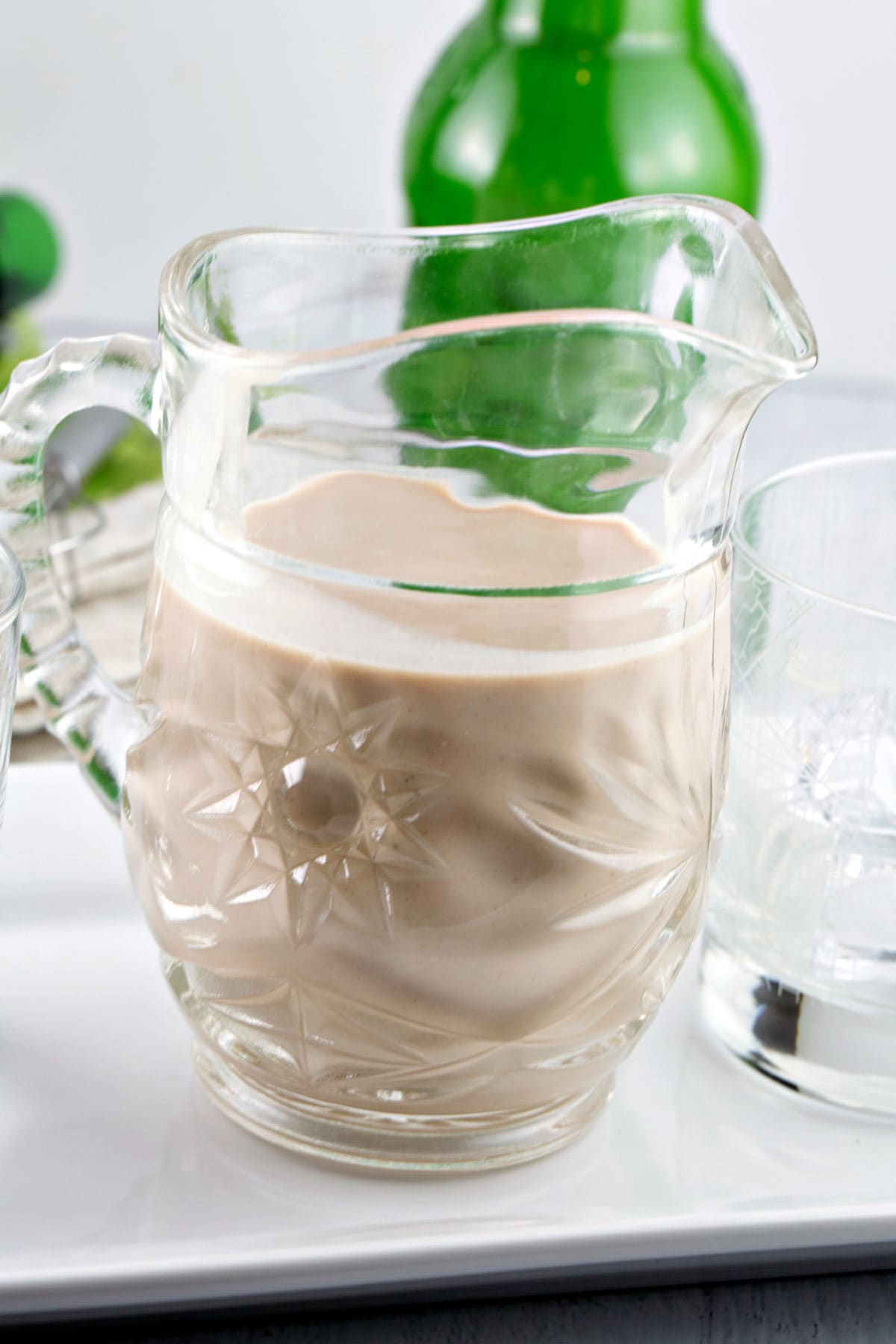 small crystal pitcher filled with easy homemade baileys