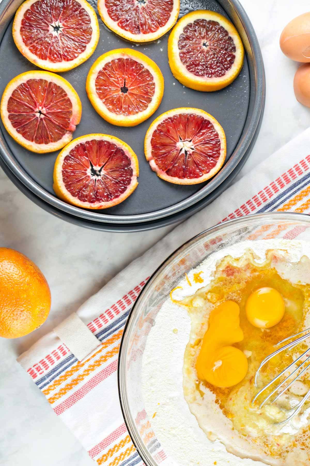 mixing bowl full of ingredients to whisk together to make cake batter