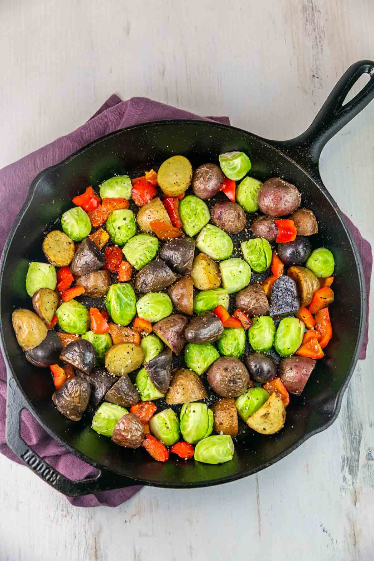 brussels sprouts and potatoes in a cast iron skillet