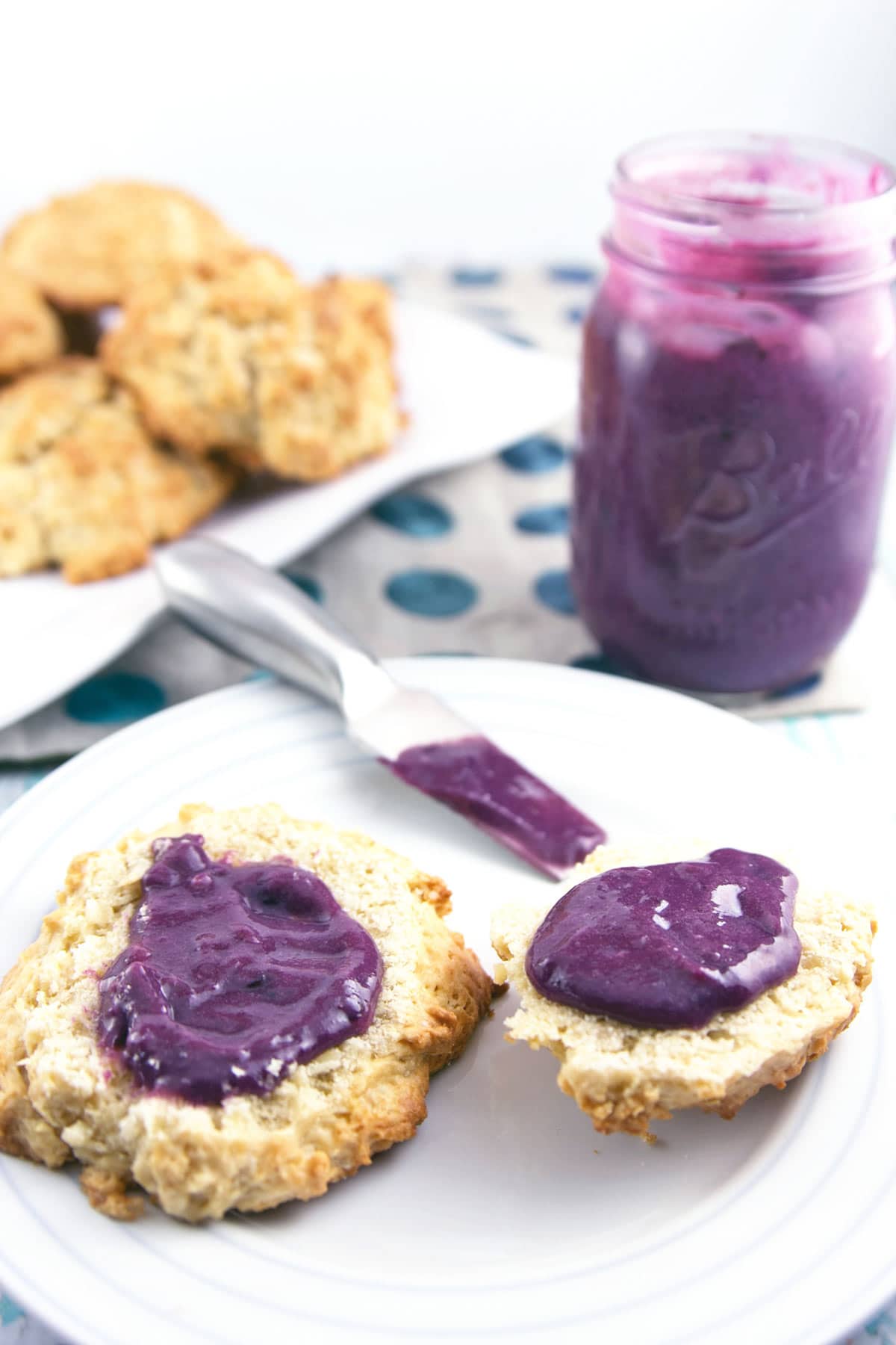 thick creamy blueberry curd spread on scones