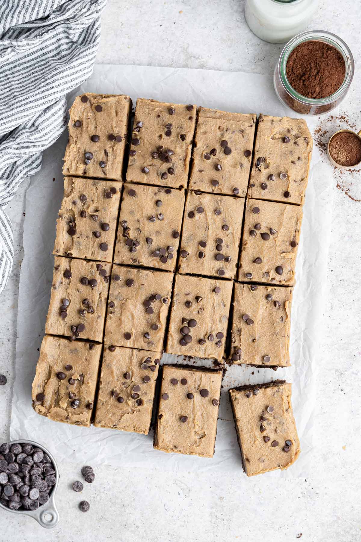 brownies with a thick layer of cookie dough on top cut into 16 rectangles