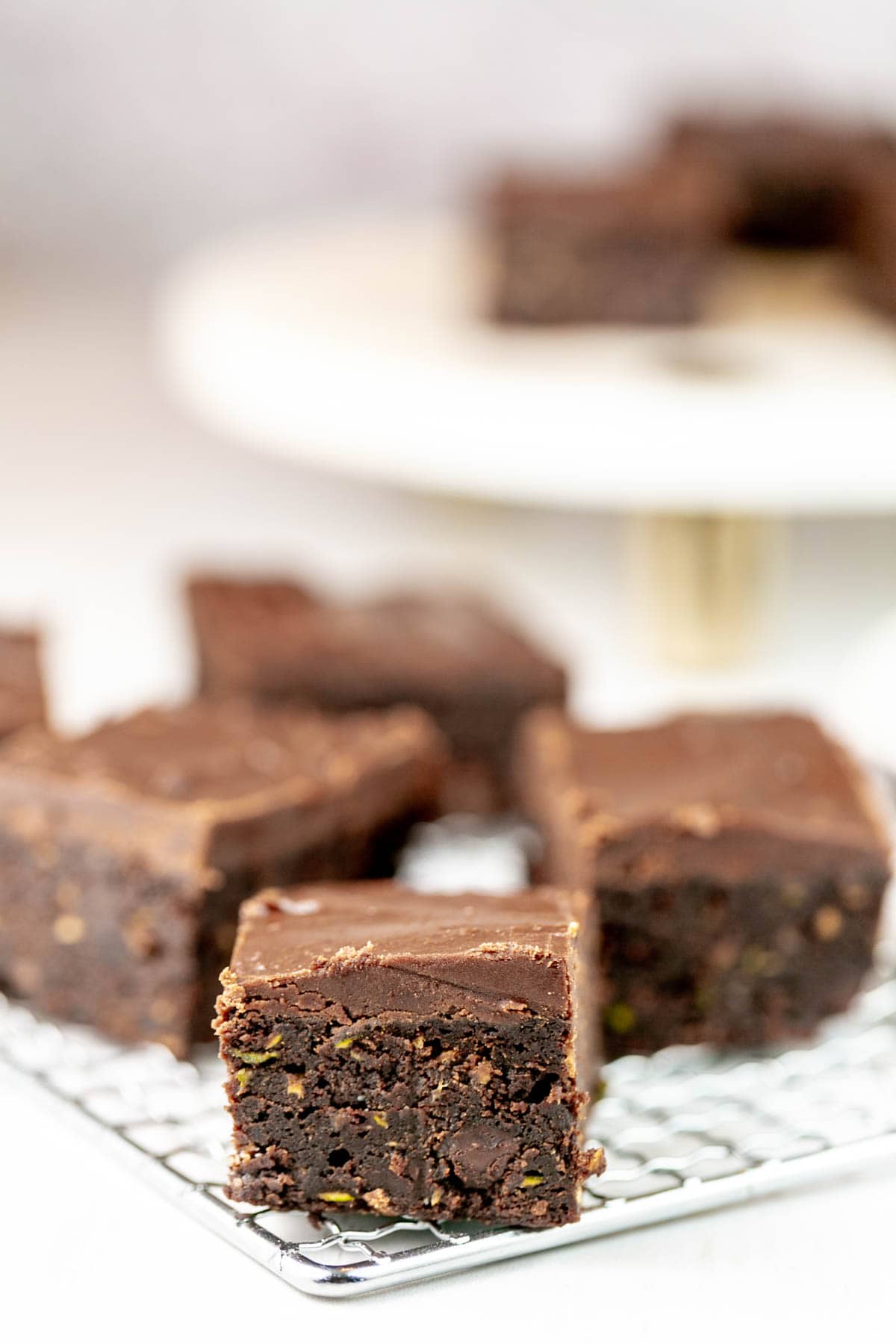 side view of brownies showing a thick layer of frosting