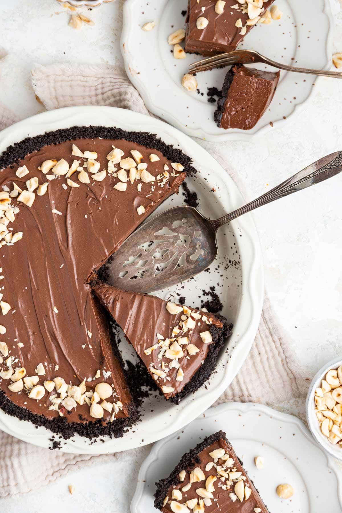 sliced pie in a white ceramic pie plate