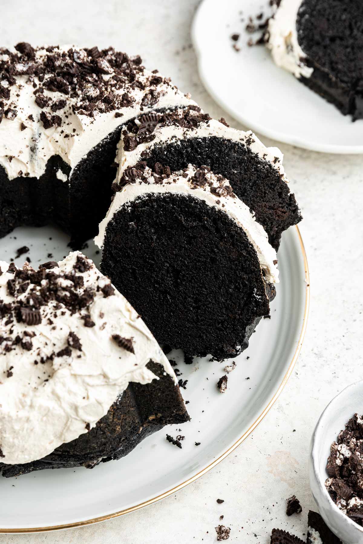 slices of oreo bundt cake angled on a cake plate