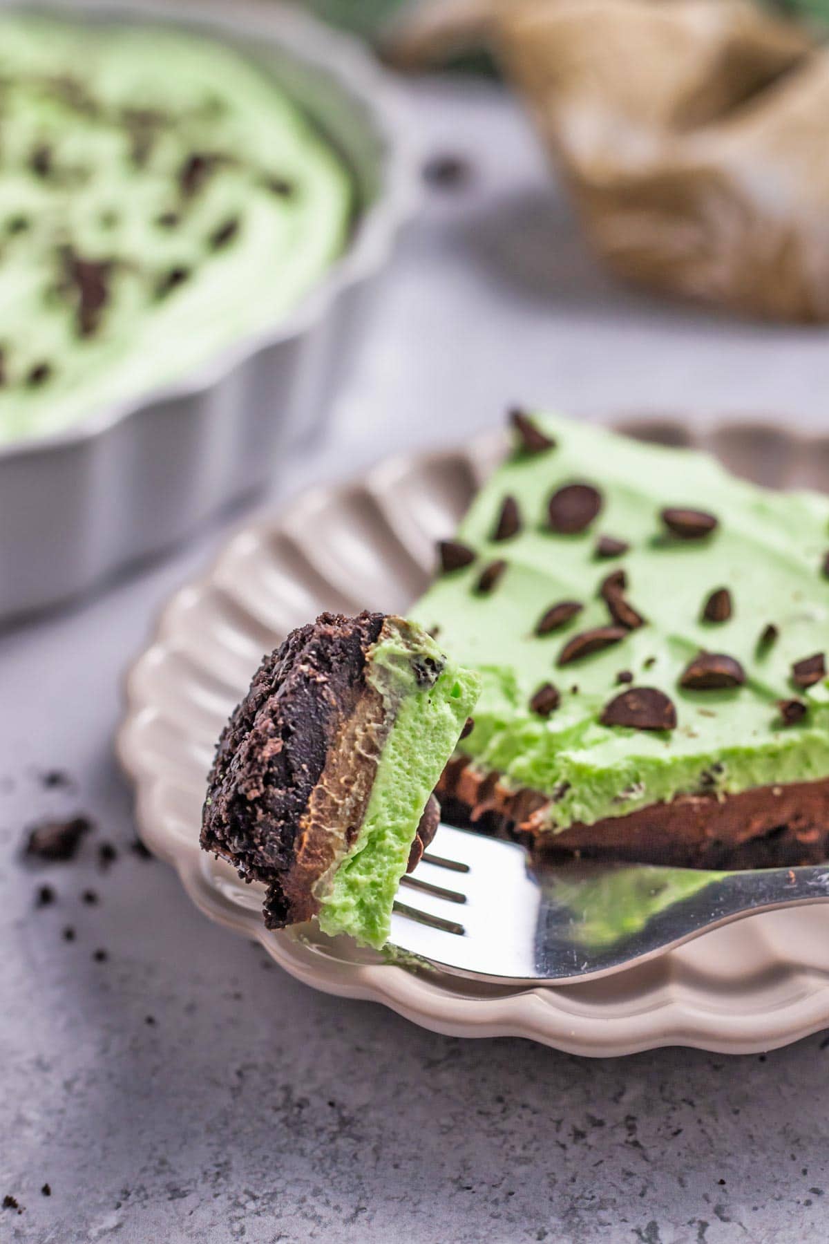 side view of a slice of pie showing the ganache and mint layers